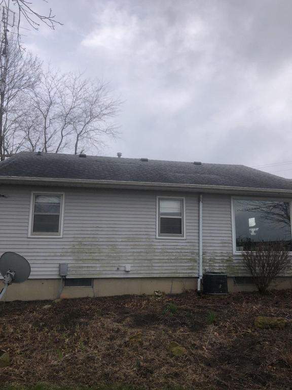 Storm damage roof replacement by Nitro Roofing and Construction