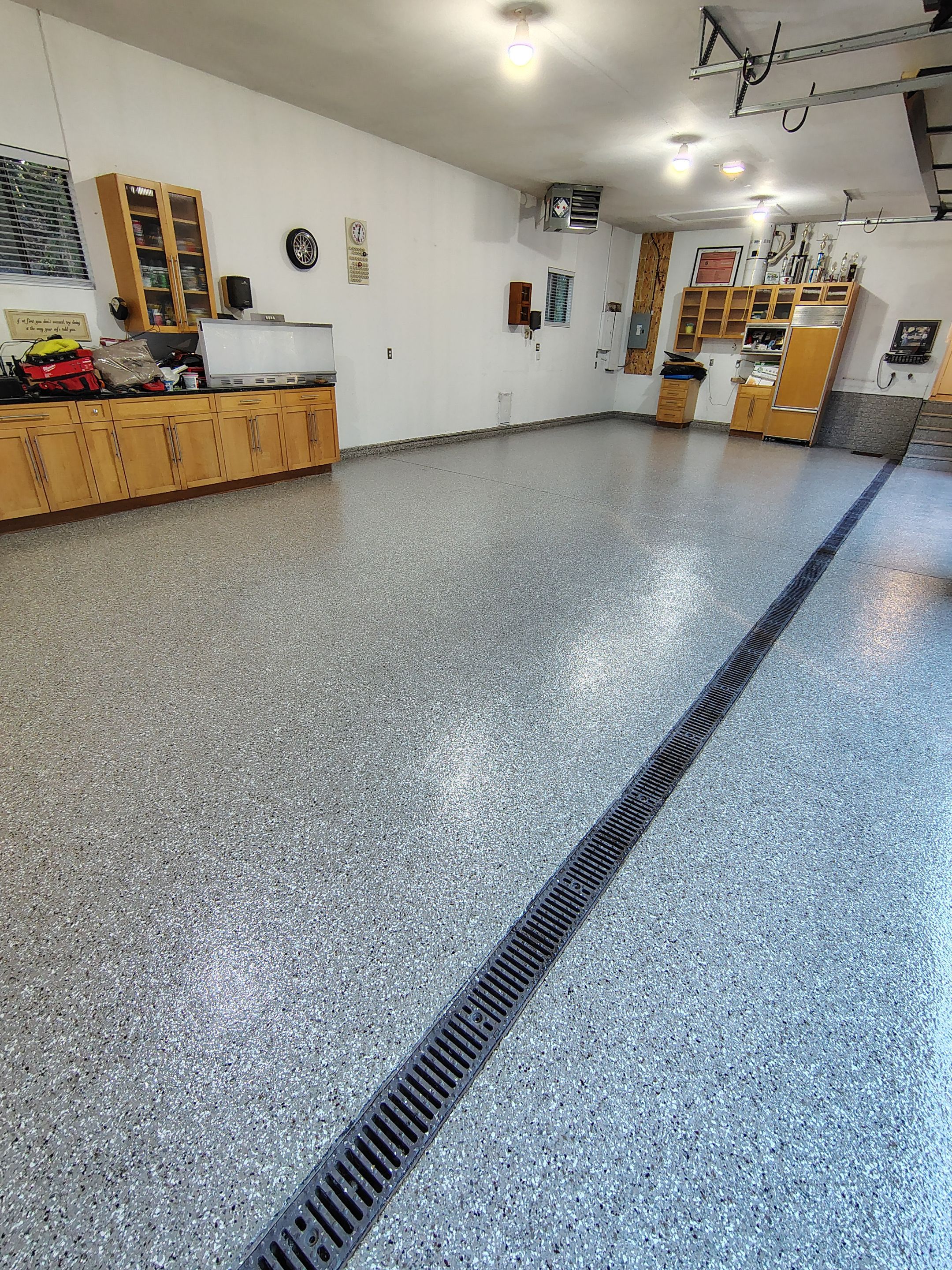 Garage Floor and Entry Step Concrete Coating in Sioux Falls by Select Painting, Coatings & Garage Cabinets