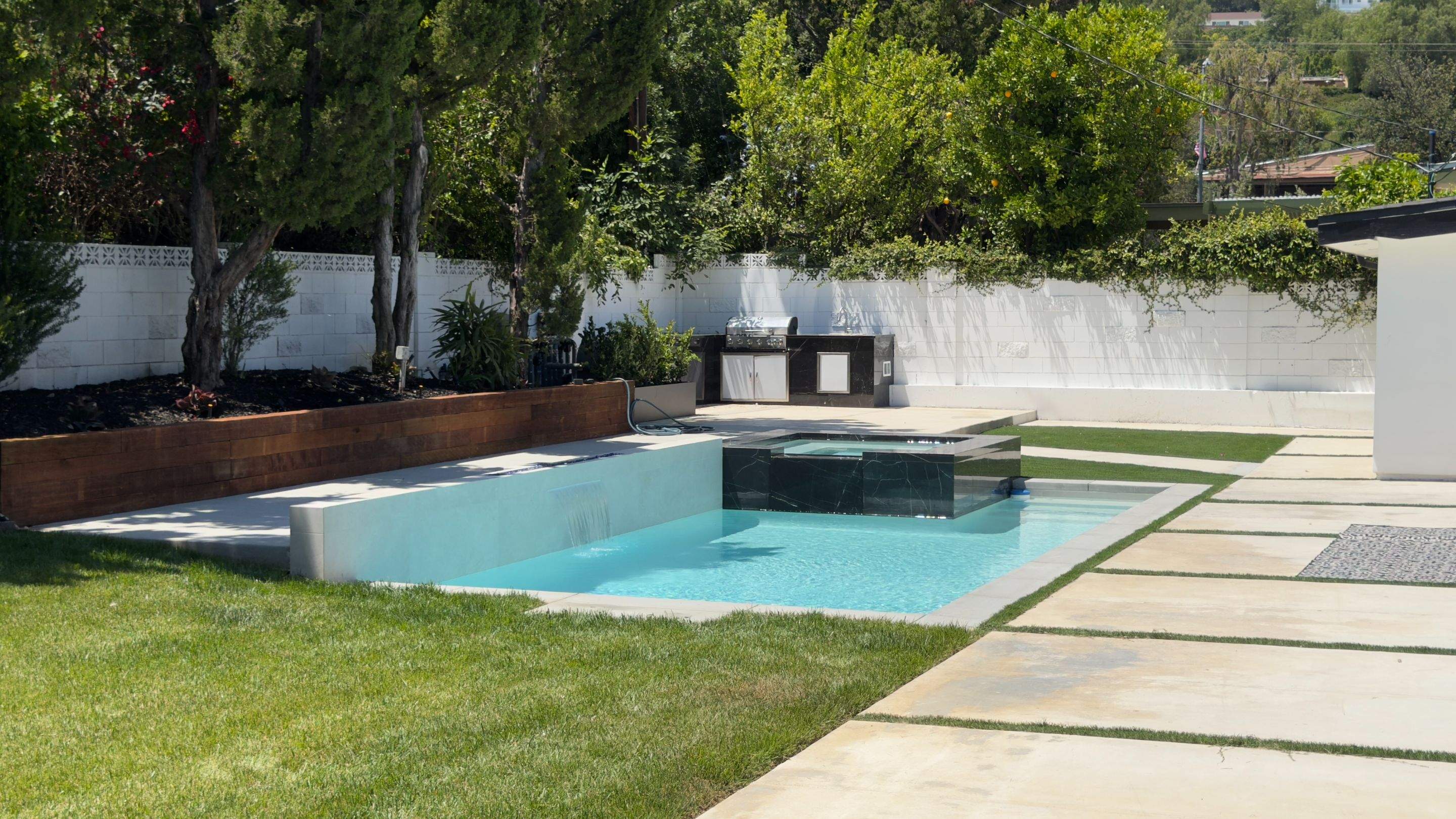 Pool With Raised Spa, Water/Fire Feature by Lax Home Inc 