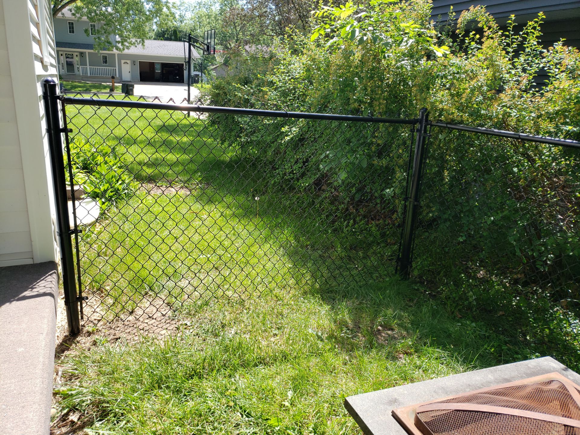 Black Chain Link Perimeter Fence and Gate Installation in Cedar Falls by Perfect Picket Fence and Stain