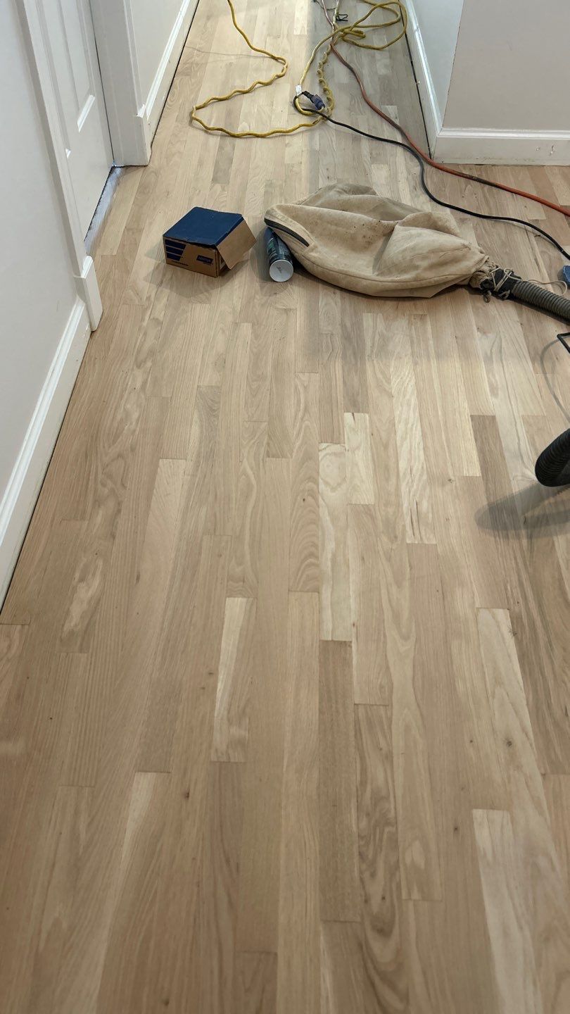 Updated staircase and hallway by Footprints Floors of Nashville