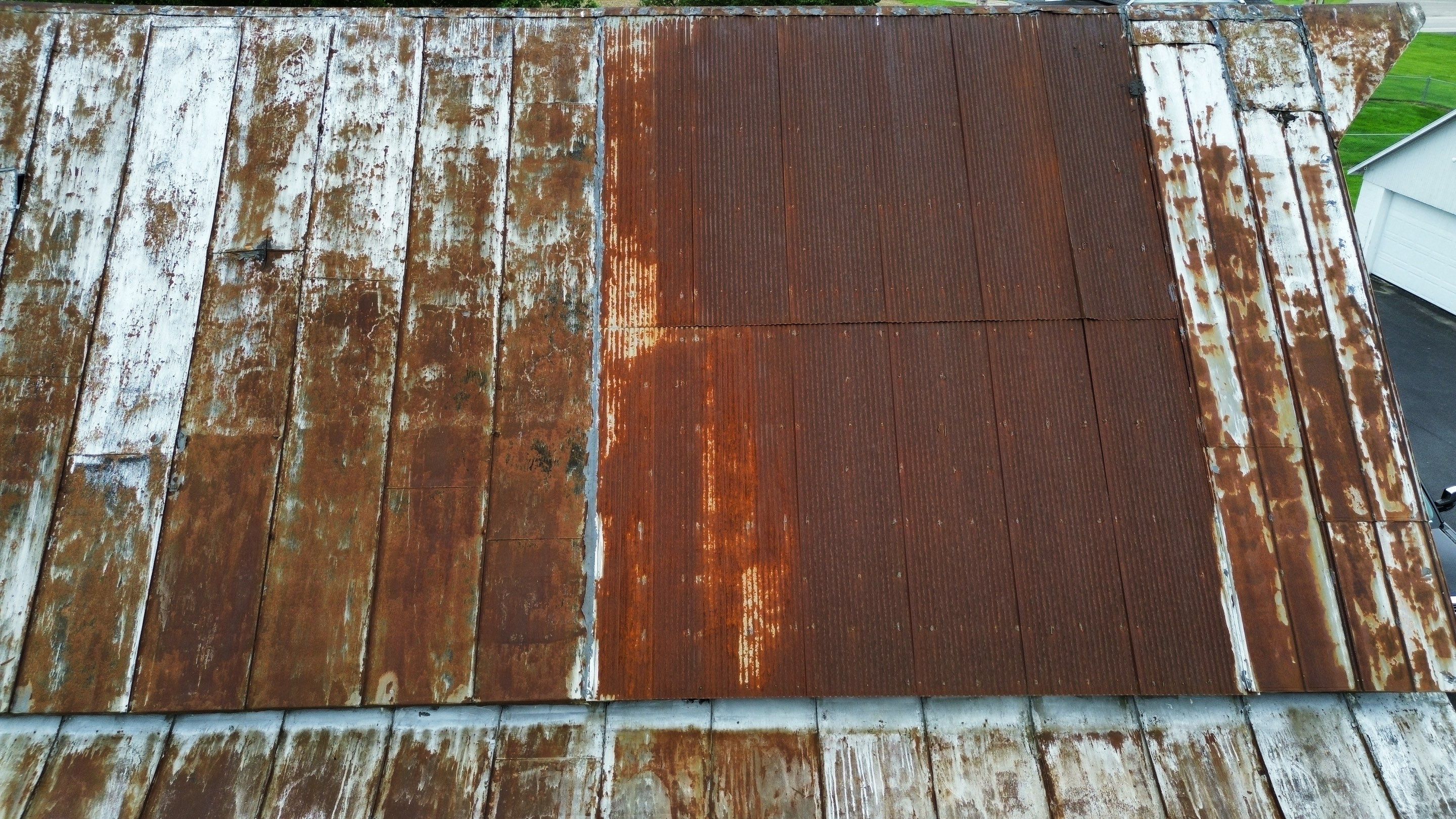 Residential Roofing Installation using Standing Seam Metal - Barn Red by RoofX 