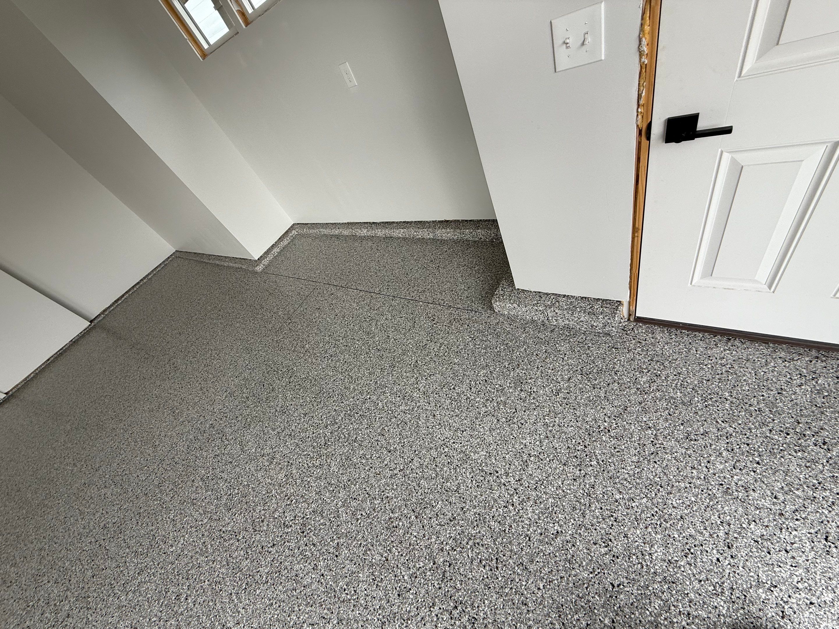 High-Gloss Epoxy Flake Garage Floor Coating in Brandon by Select Painting, Coatings & Garage Cabinets