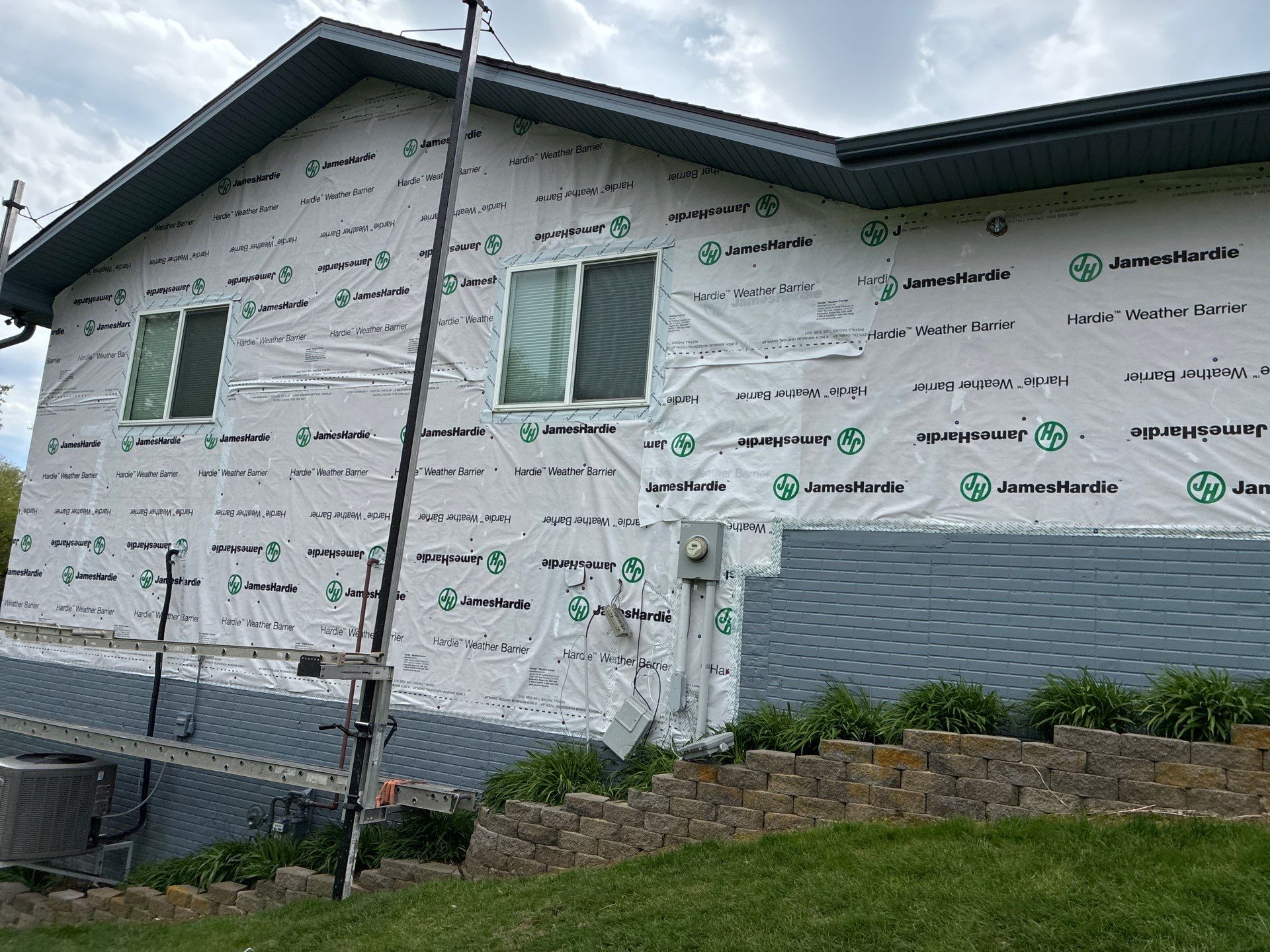 Evening Blue Siding and Window Replacement in Glenwood, Iowa by Carps Complete Exteriors 