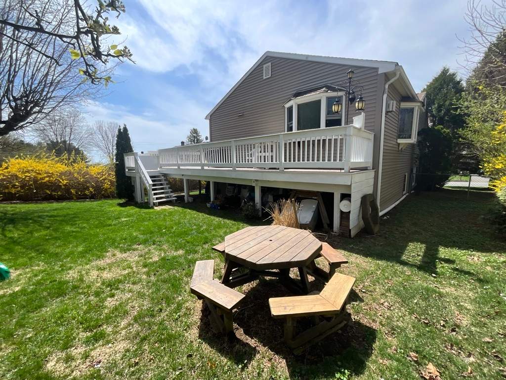 Deck Replacement using Trex Tropical Spiced Rum decking and Transcend White Railing by DiGiorgi Roofing and Siding Inc