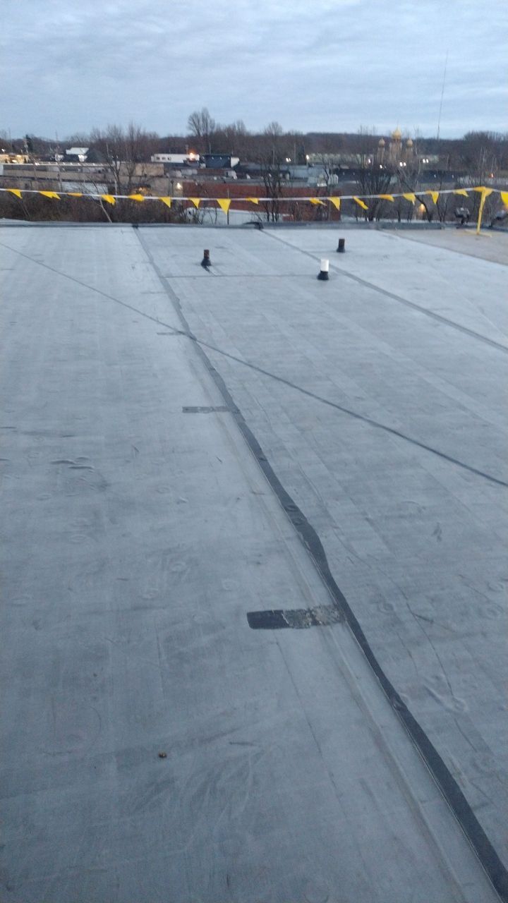 Commercial flat roof parma by Absolute Roofing and Construction