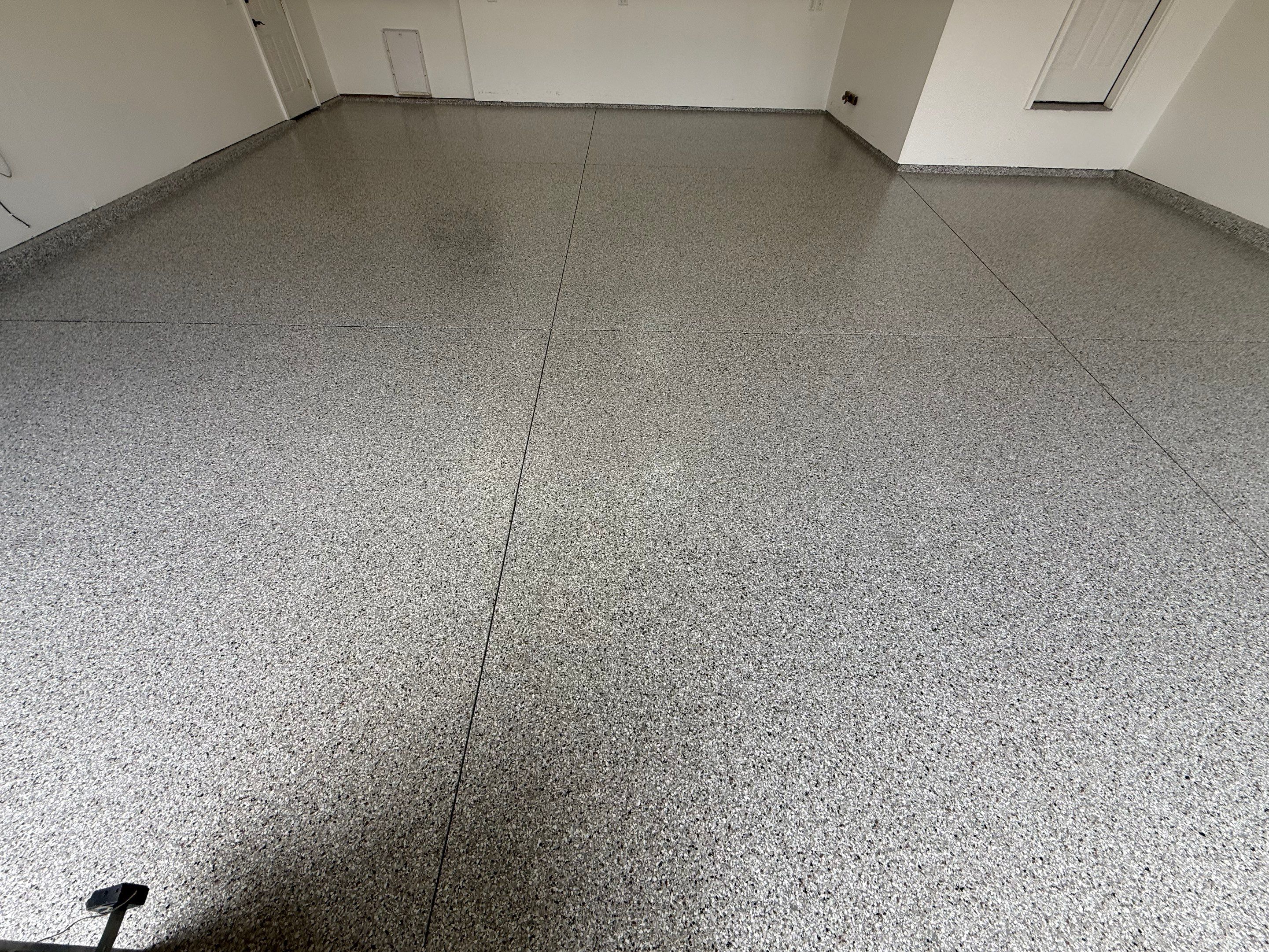 Full Garage Floor Resurfacing and Decorative Epoxy Flake Finish by Select Painting, Coatings & Garage Cabinets