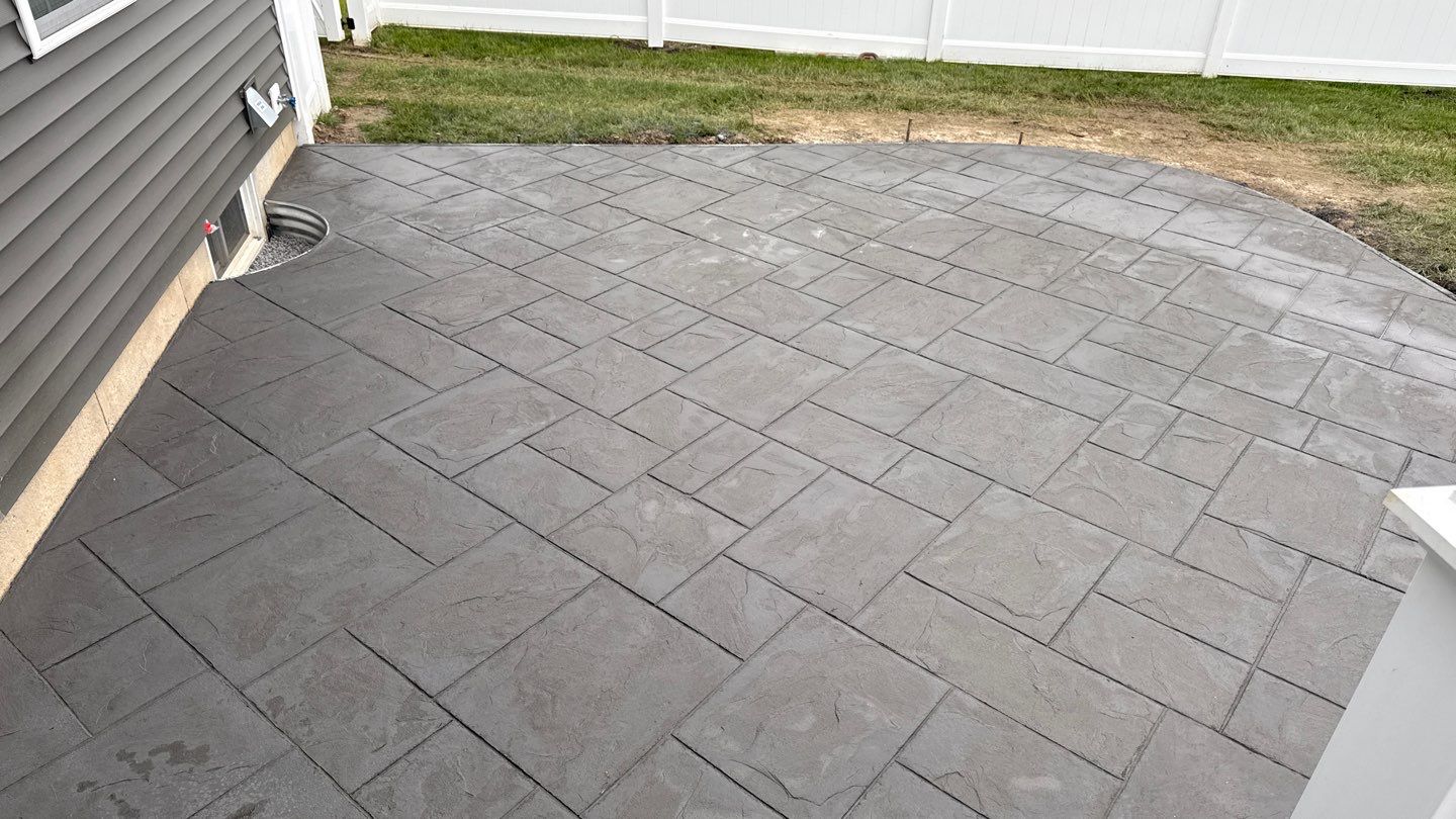 Majestic Ashlar stamped concrete patio  by NG Masonry & Construction LLC