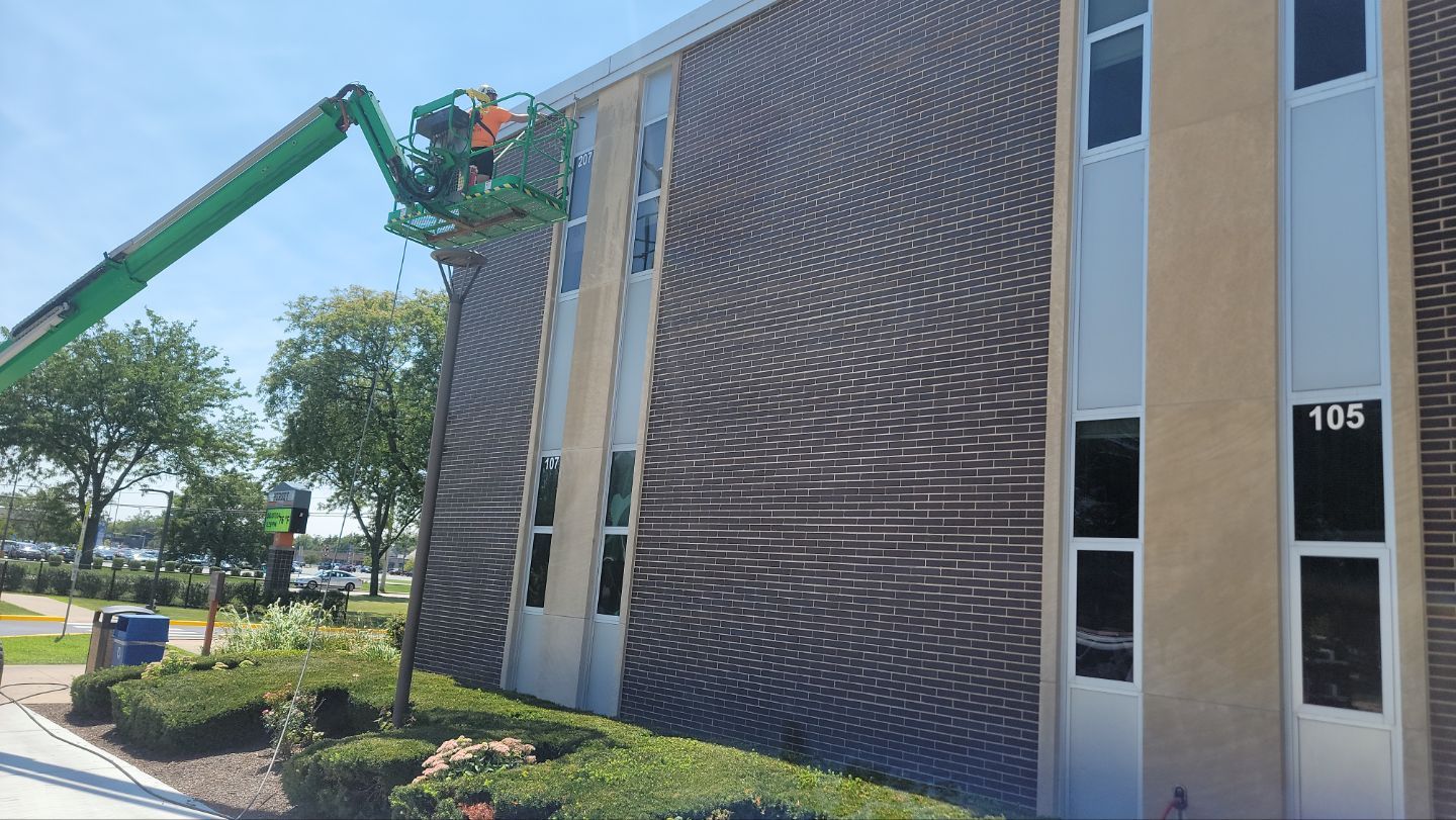 commercial pressure washing using Algaecide, soft wash soap by Northern Power Washing LLC.