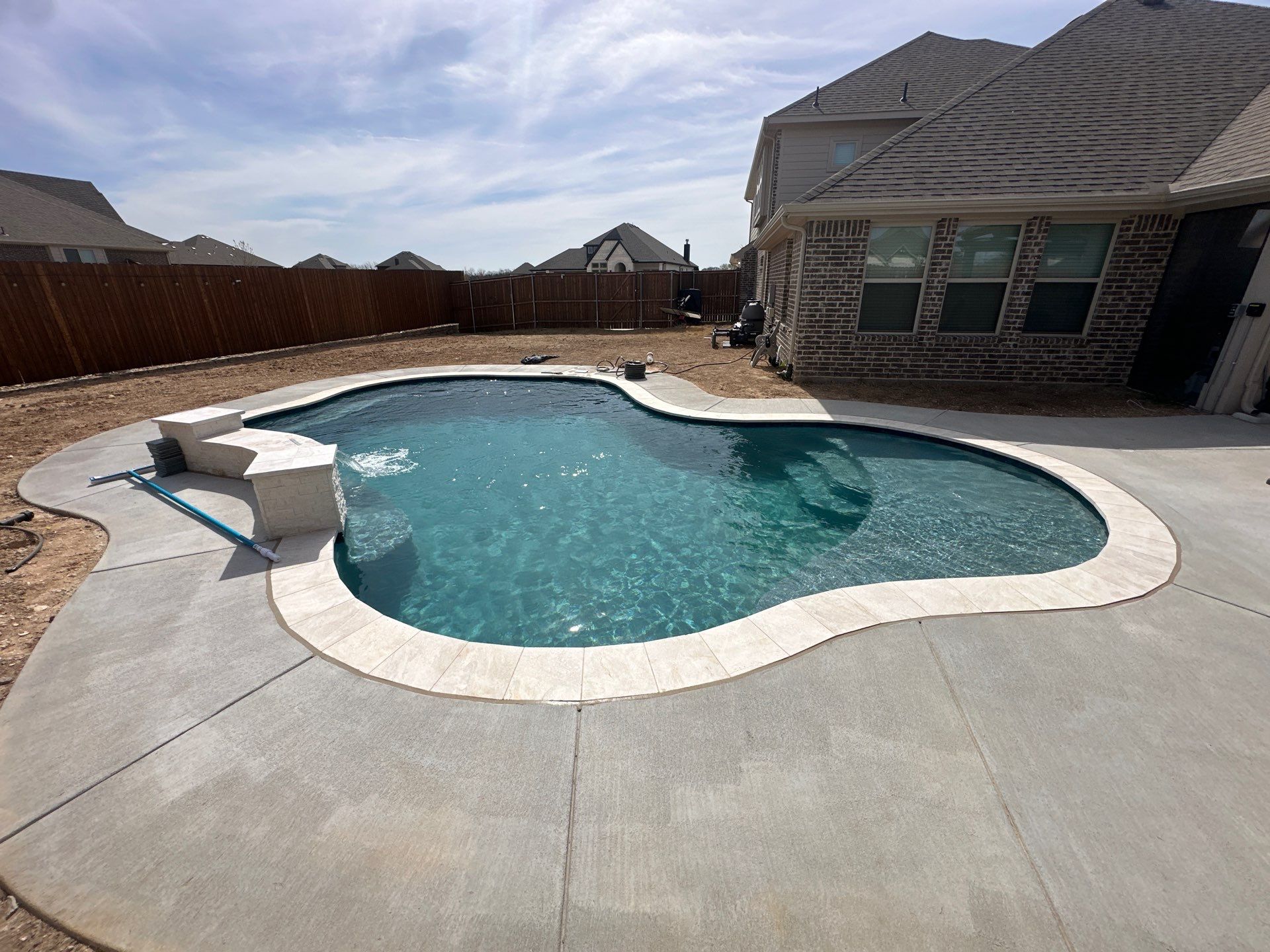 Large Freeform Pool with Tanning Ledge by Pinnacle Pools and Spas - DFW