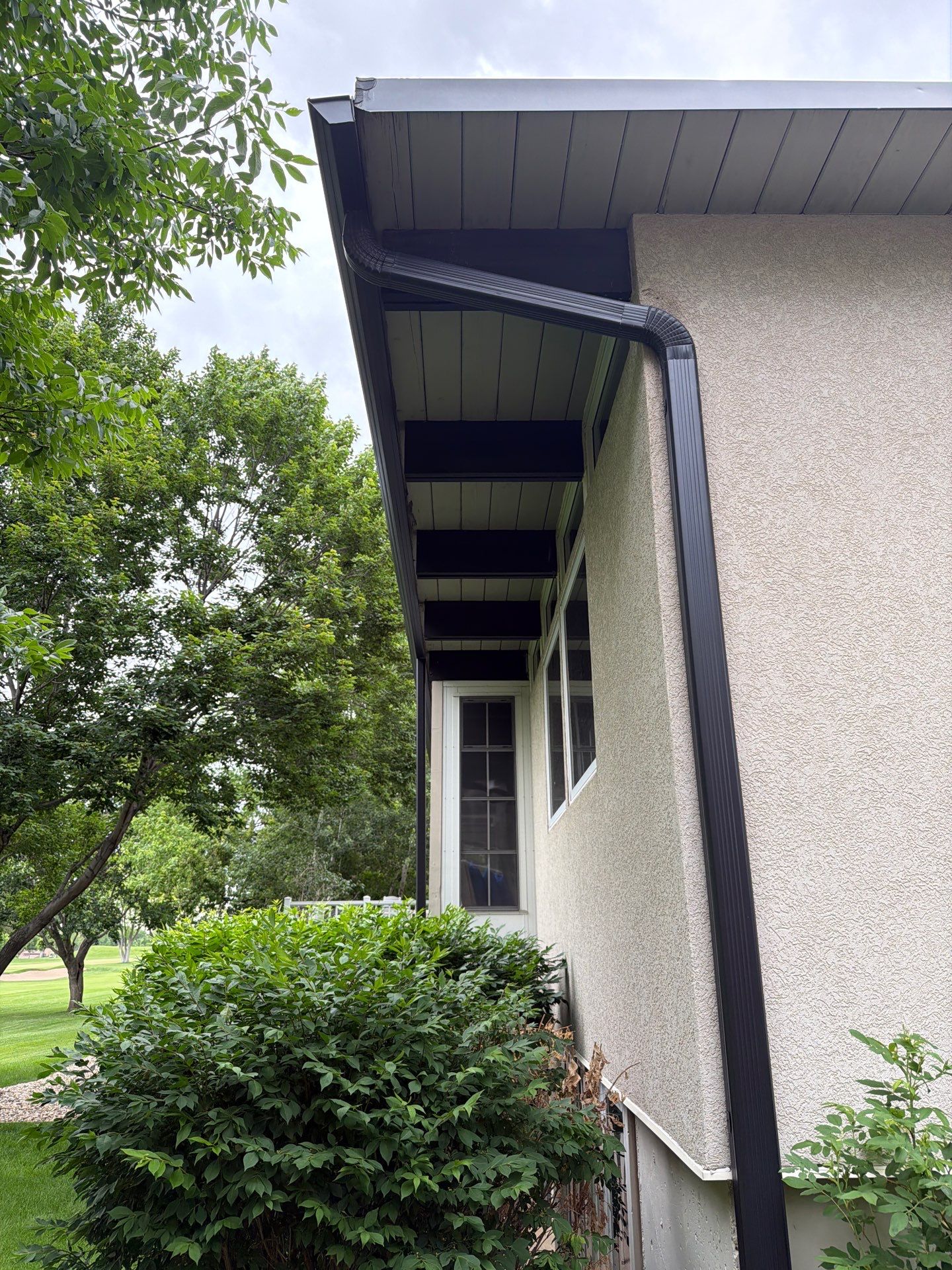 Exterior Trim Painting and Rafter Staining in Sioux Falls by Select Painting, Coatings & Garage Cabinets
