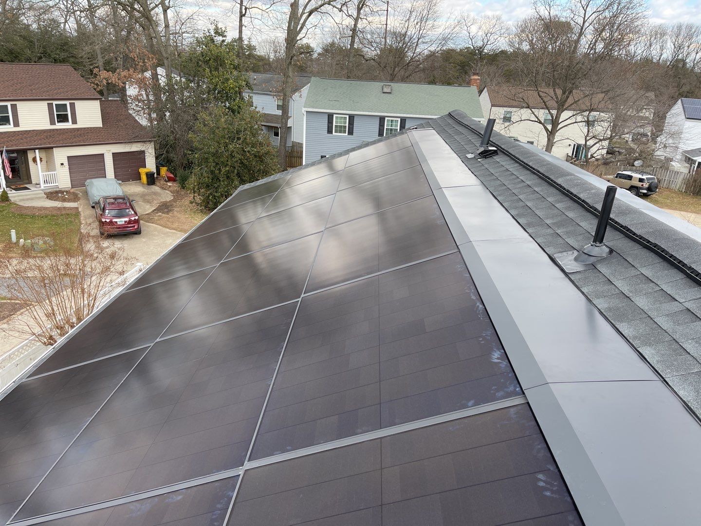 Roof Replacement with GAF Decotech integrated solar panels by American Home Contractors