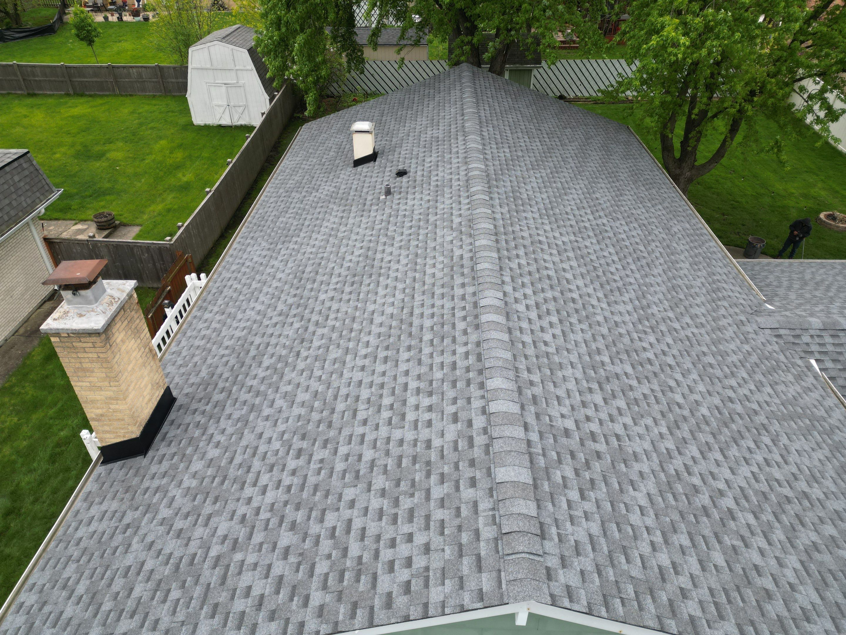 Roof replacement and chimney flashing by Optimal Home Improvement 