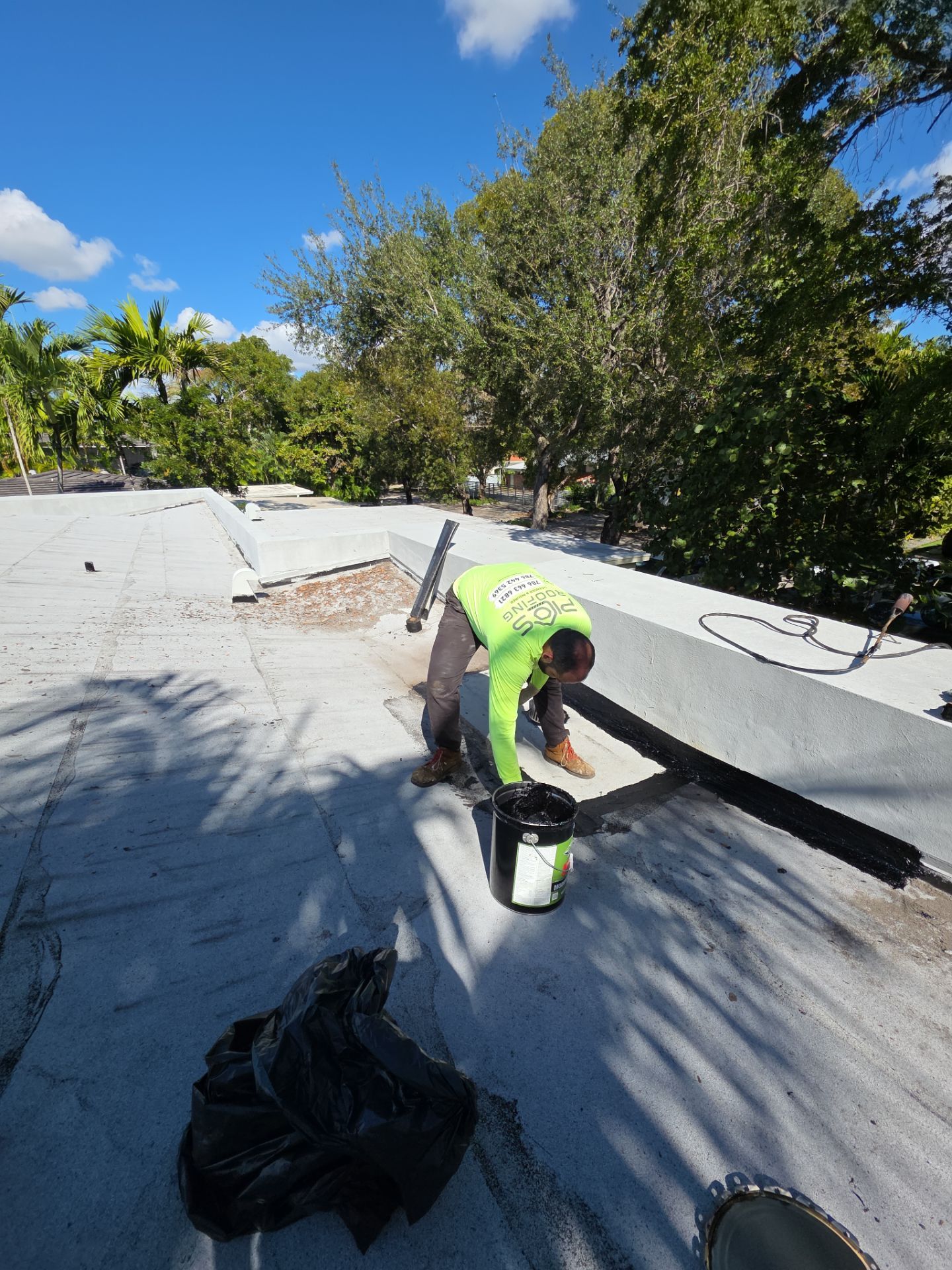 Flat Roof Silicone Coating and Interior Water Damage Restoration in Miami by Picos Construction Engineering