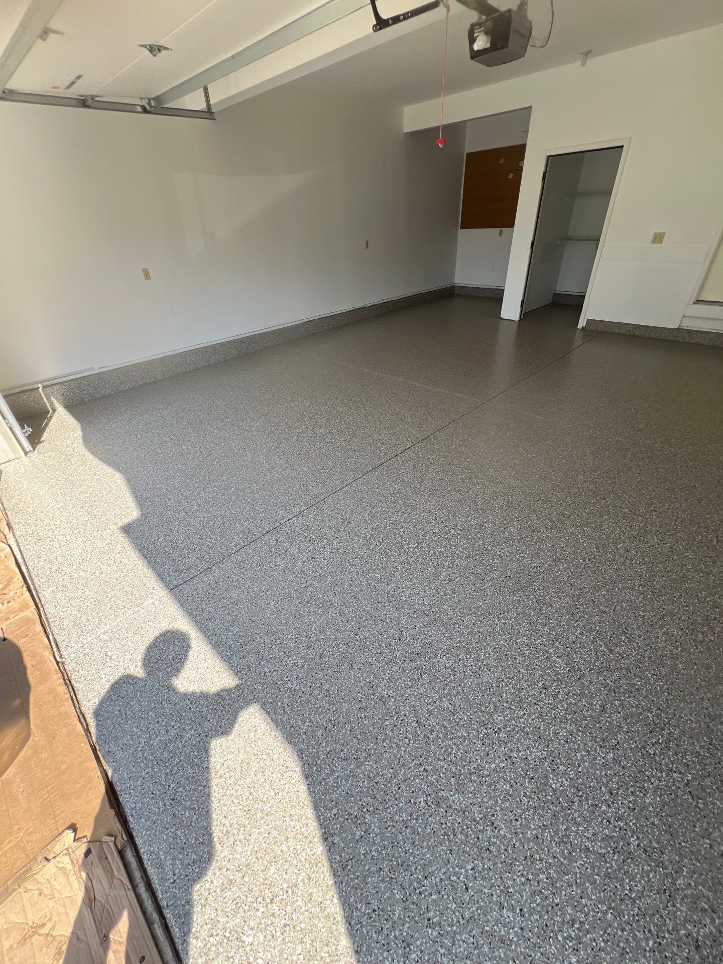 Garage floor in Holt using Smoke Flake by Freedom Concrete Coatings. 