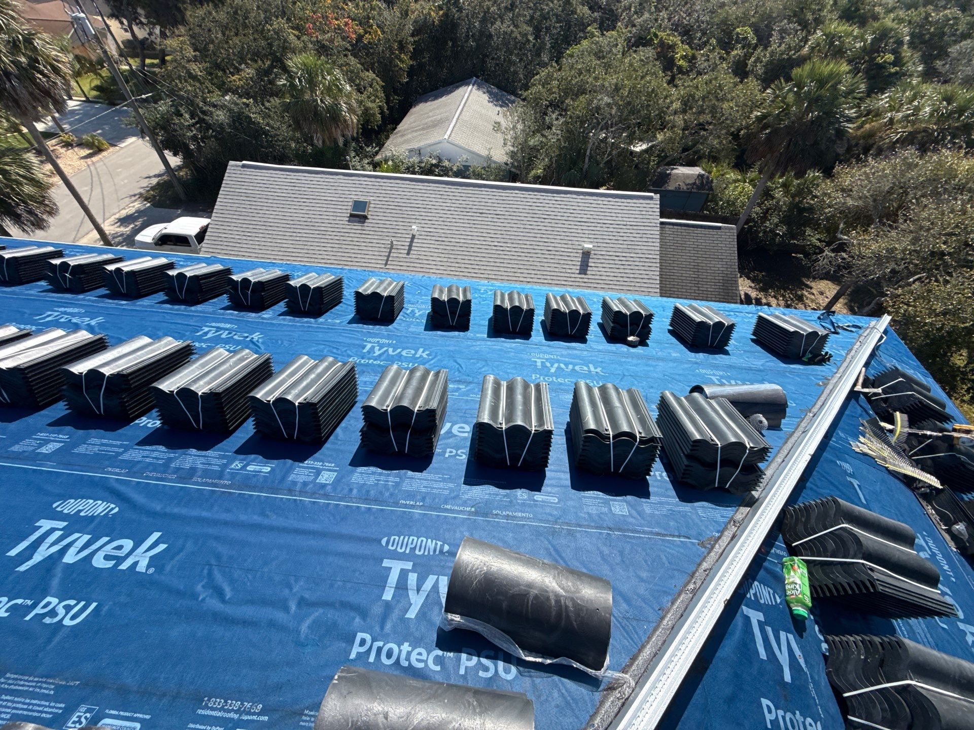 Flagler Beach Residential Tile Roof Replacement with Dark Barrel Tiles by Fortified Roofing Solutions Corp.
