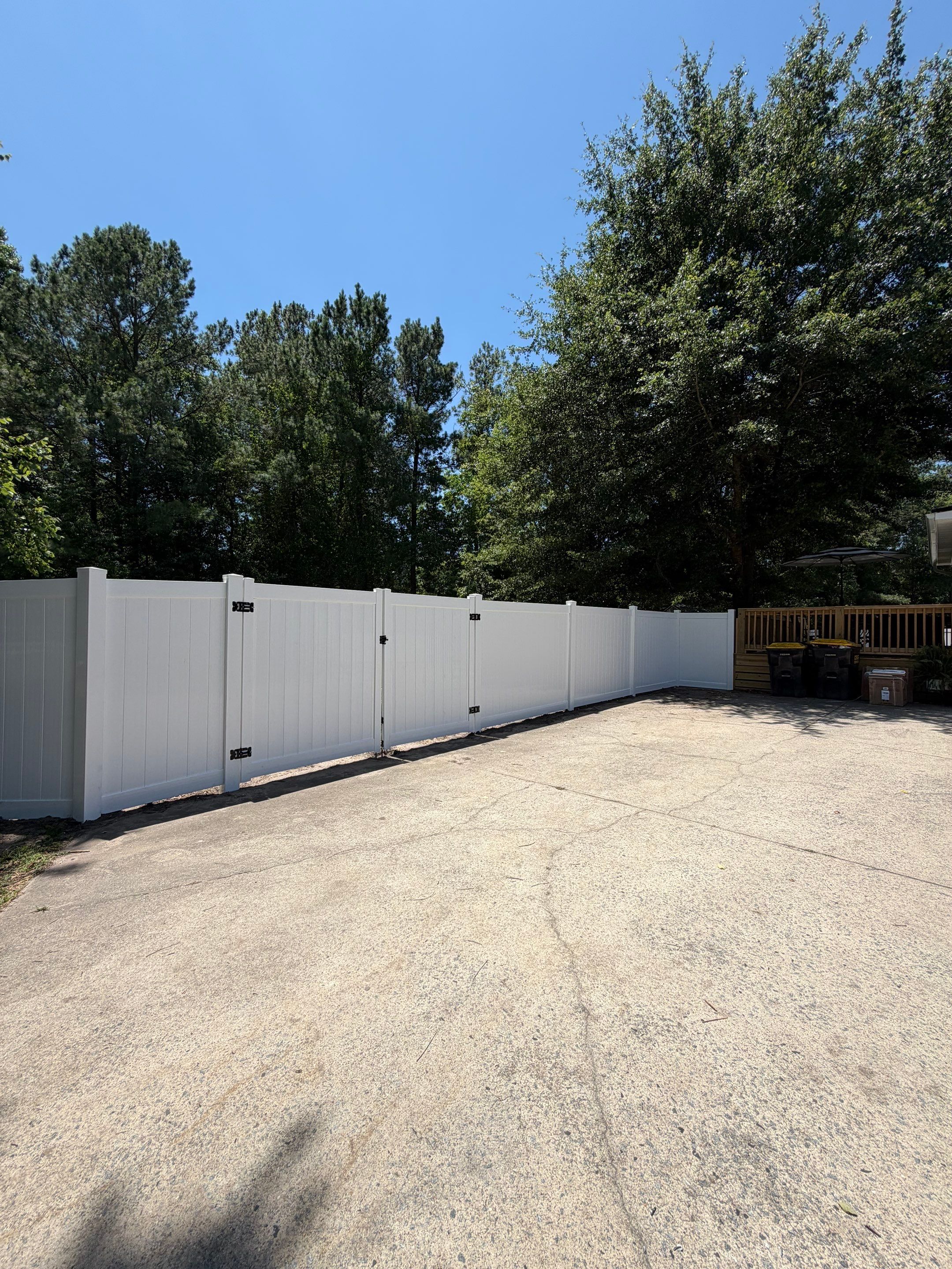 White Vinyl Privacy Fence Replacement with Double Gates in Greenville by Superior Fence and Rail
