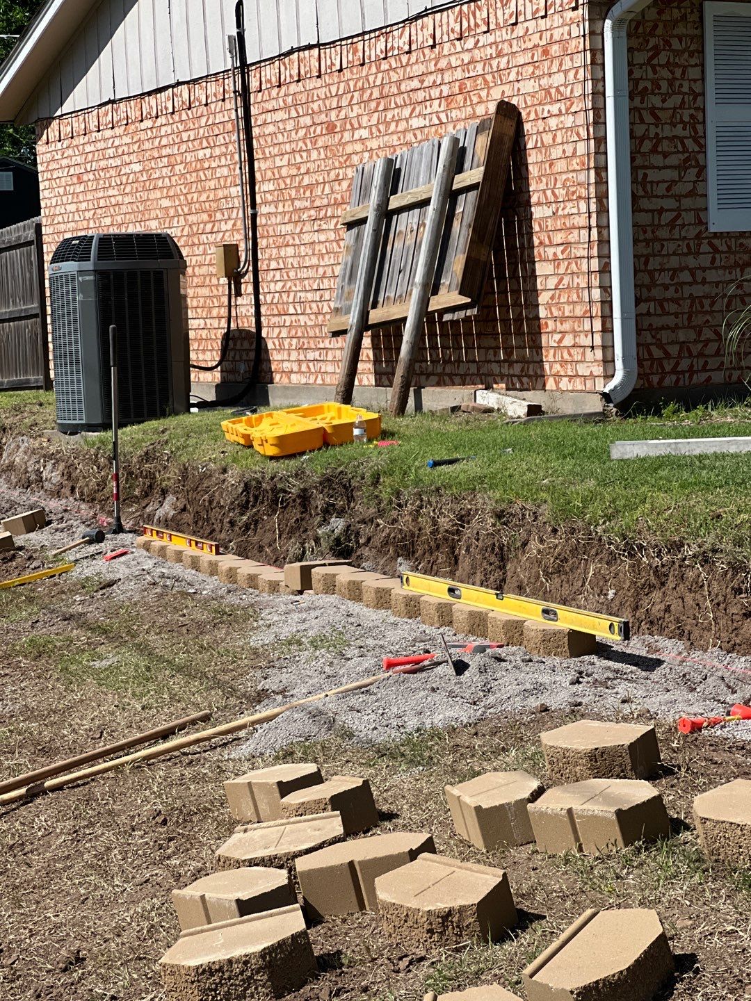 Retaining Wall using Rocks by Clays Services Inc