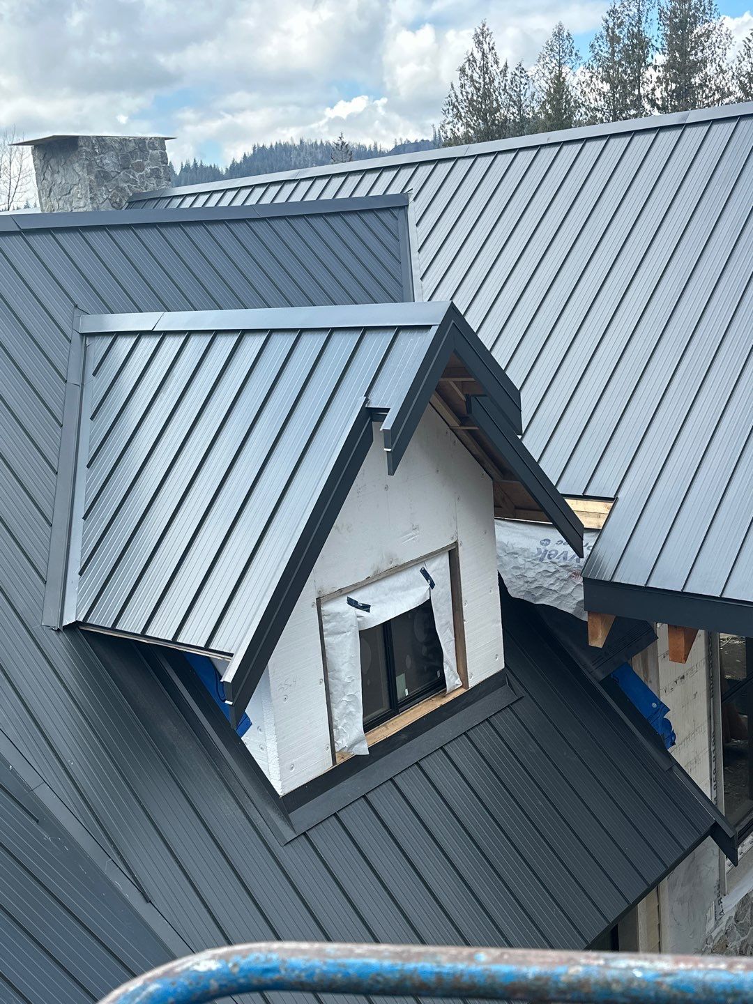 Residential Roofing Installation using 12" Prolok metal by Top Notch Roofing Inc