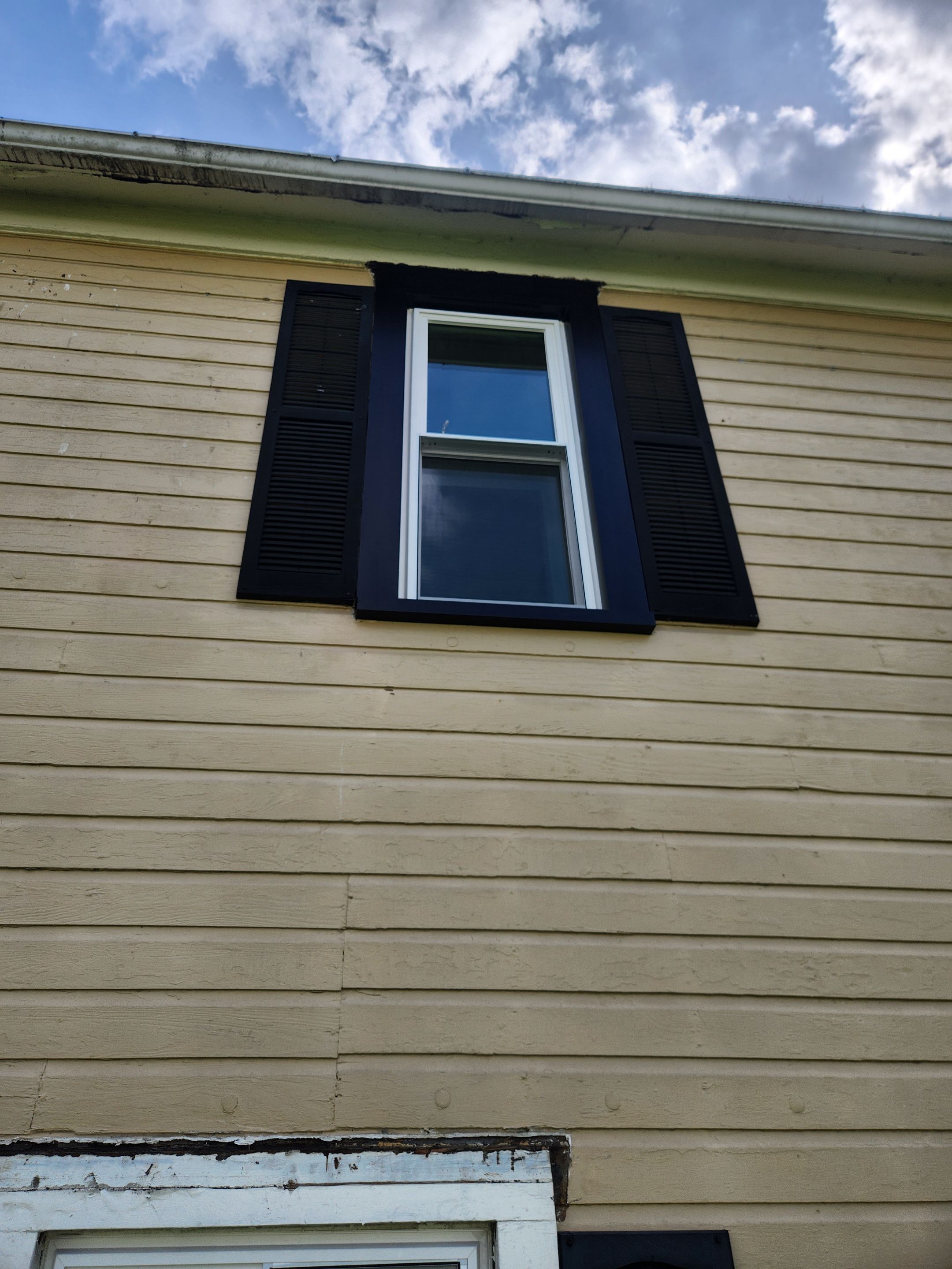 Vinyl Window Replacement and Black Shutter Installation in Dennison by Ohio State Windows