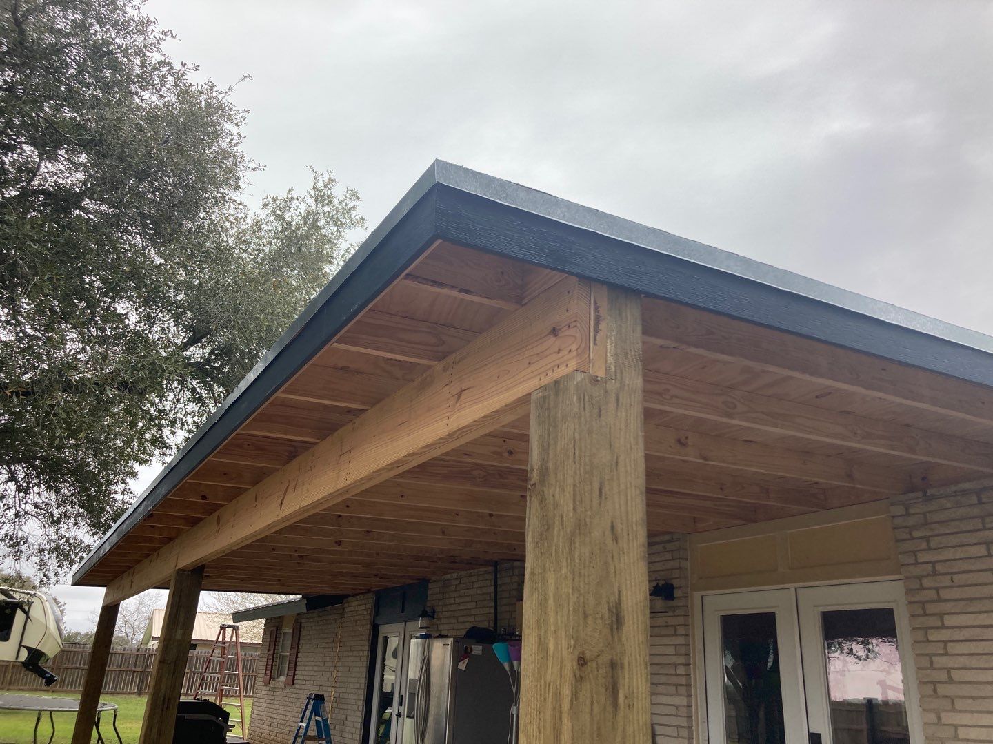Beeville Backporch sittin' by Bayfront Roofing and Construction