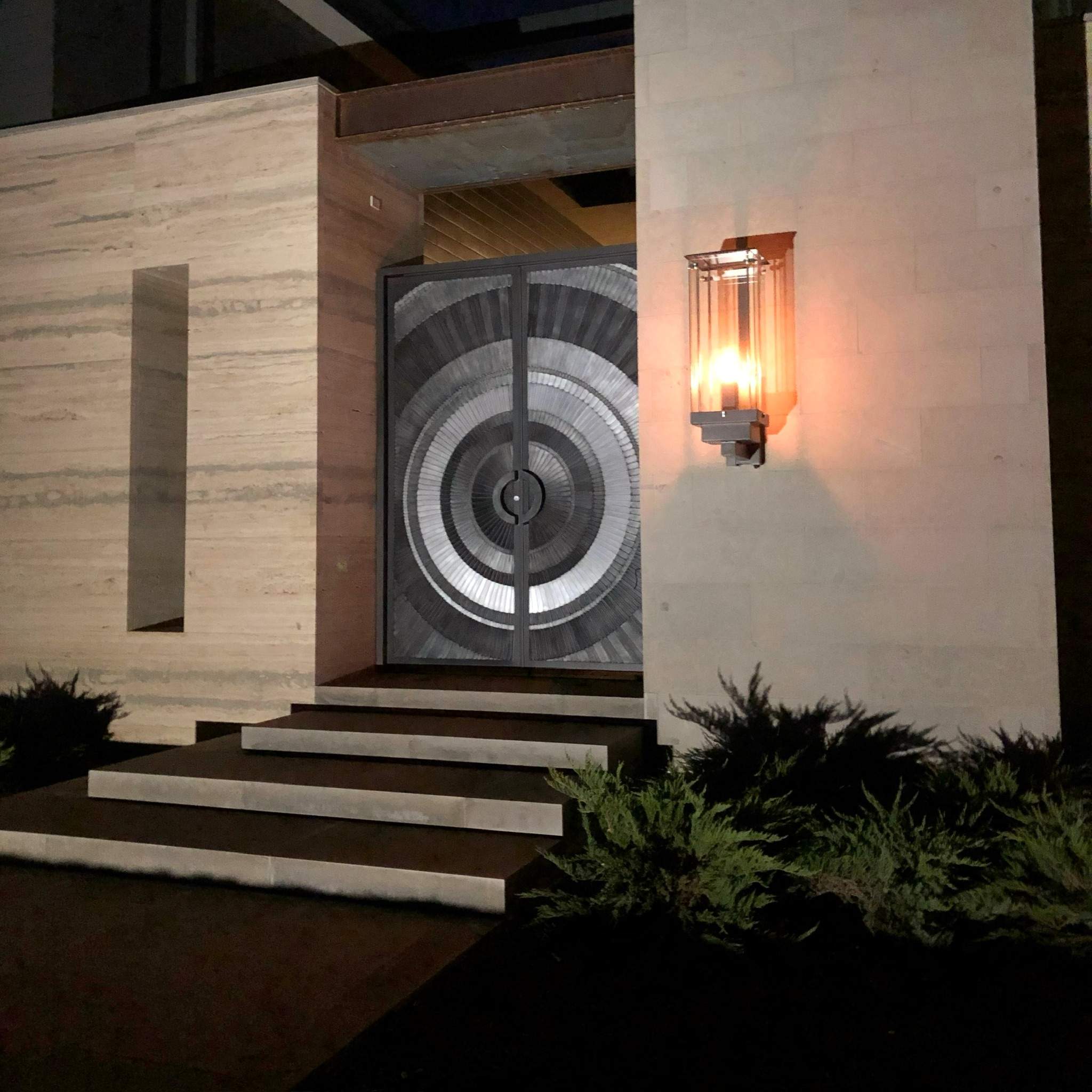 Custom Metal Entry Door and Exterior Lighting Installation by Solara Custom Living