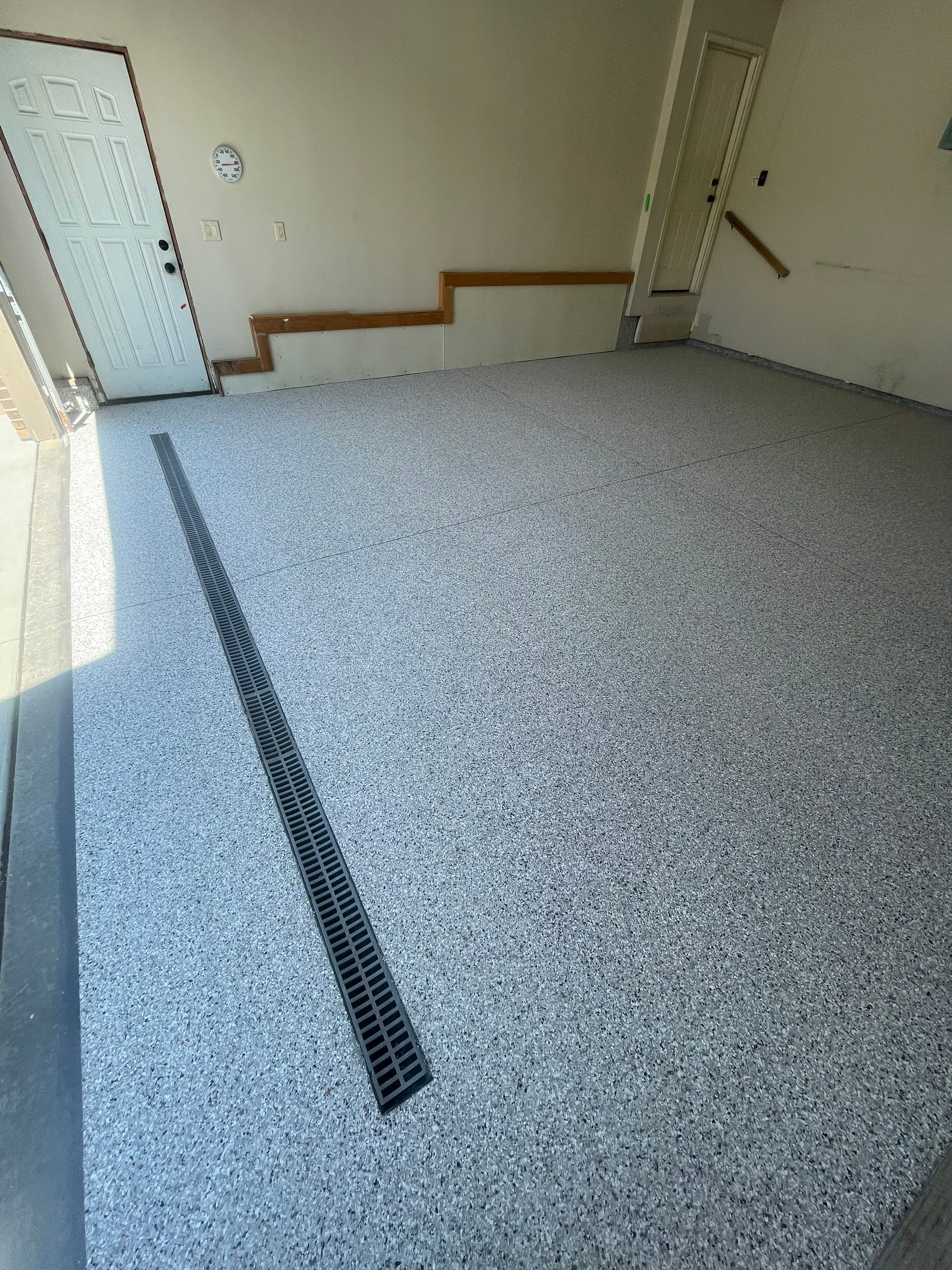 Multi-Stall Garage Floor Coating Installation in Sioux Falls by Select Painting, Coatings & Garage Cabinets
