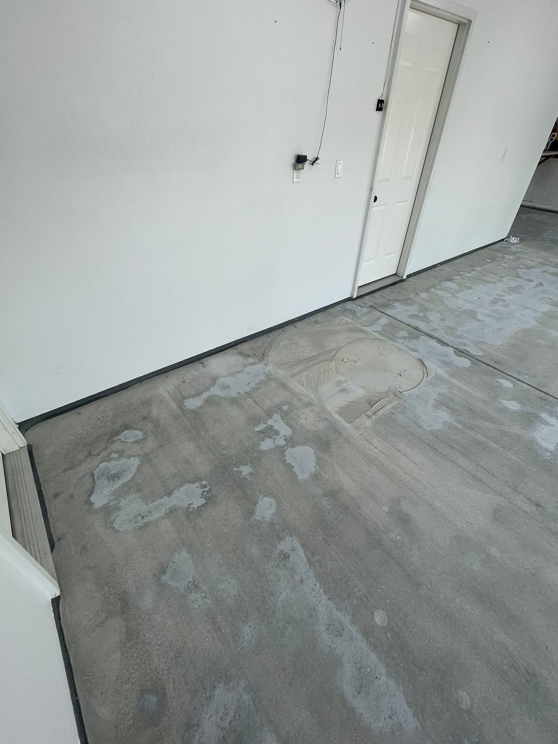 Multi-Car Garage Concrete Coating with Coyote Flake Finish in Sioux Falls by Select Painting, Coatings & Garage Cabinets