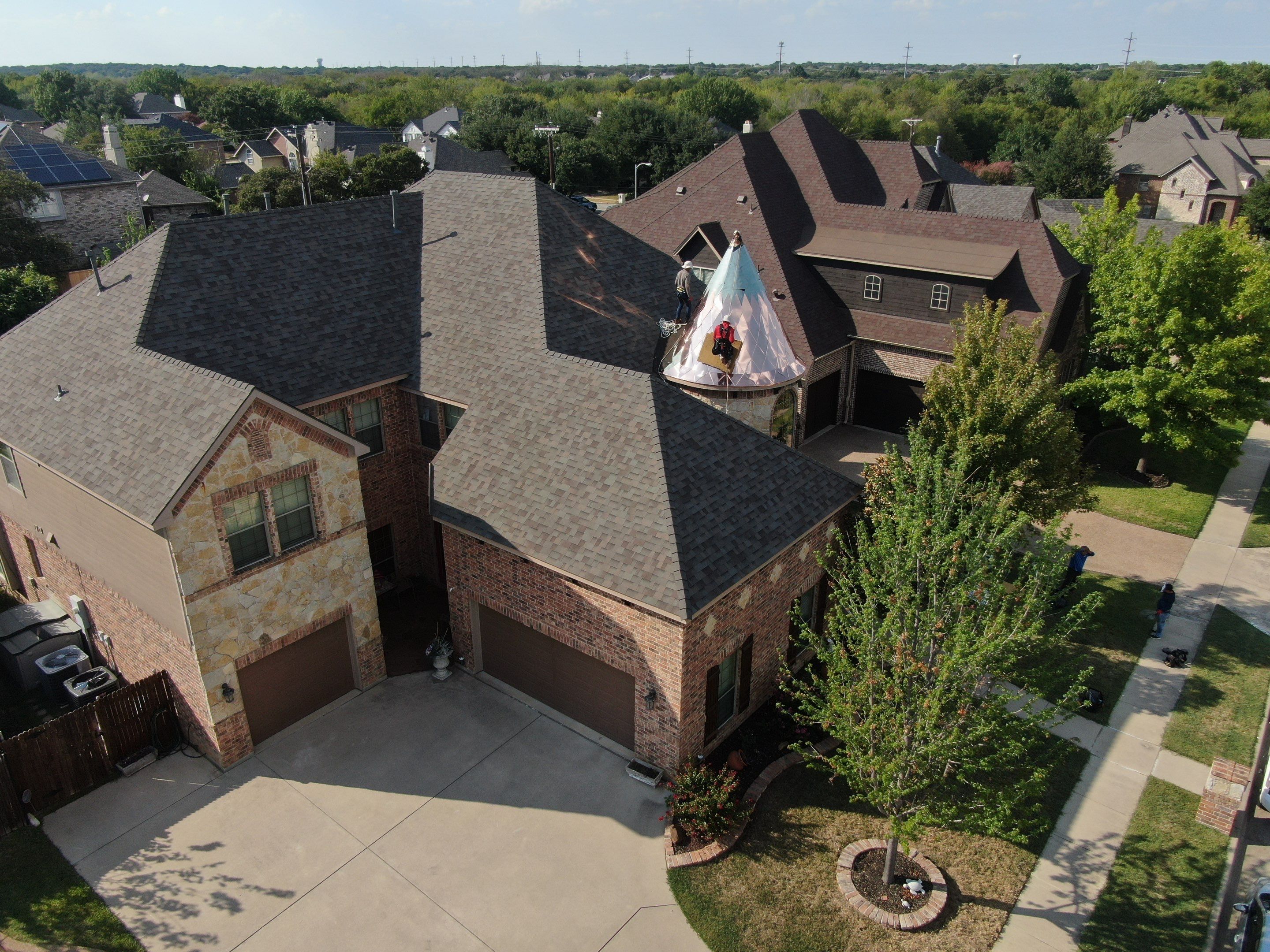 Installing Custom copper turret and Malarkey Vista Class 4 shingles Hail Damage Upgrade by Becker Roofing and Exteriors