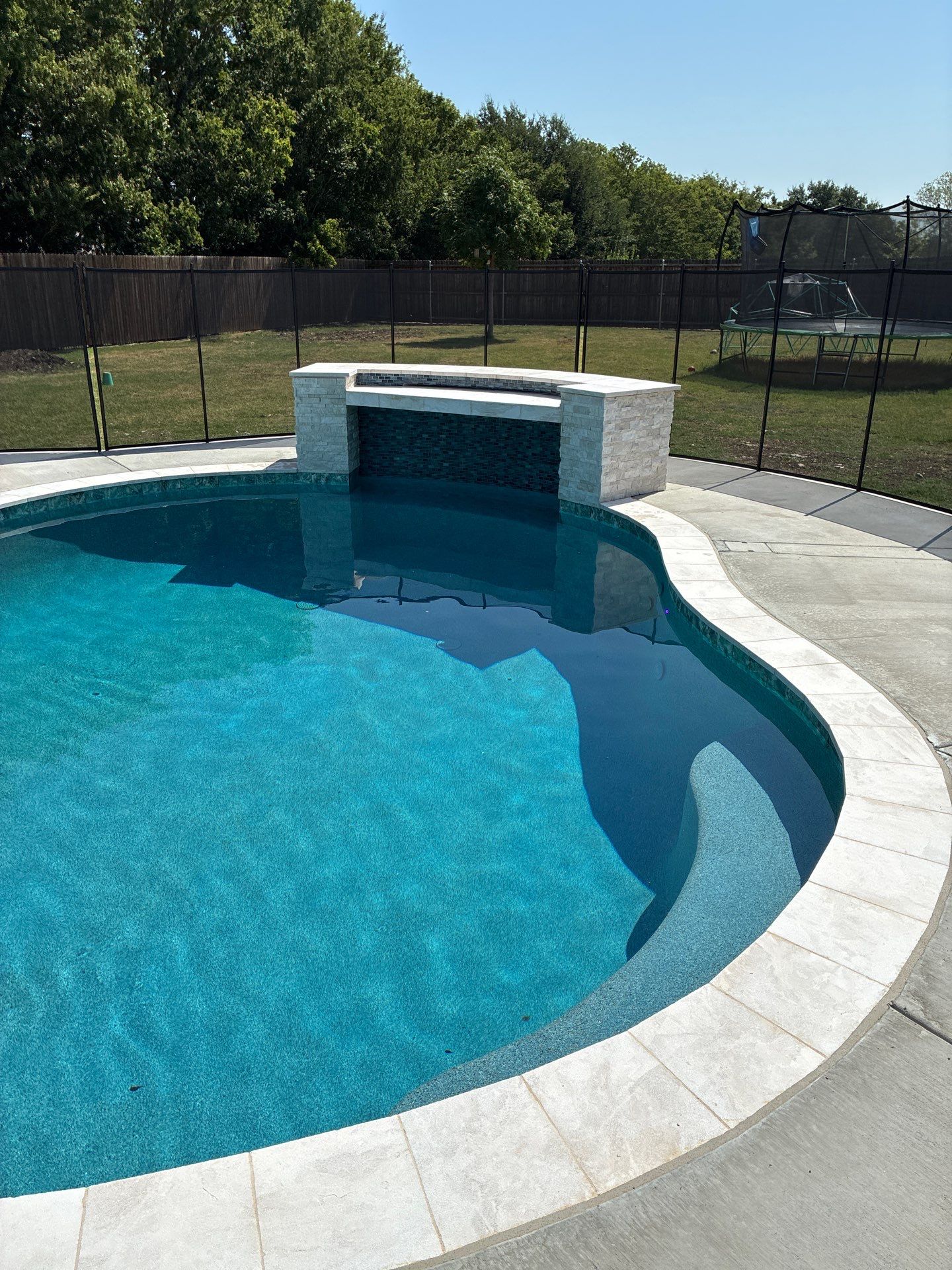 Freeform Pool with Raised Spa and Fire Feature by Pinnacle Pools and Spas - DFW
