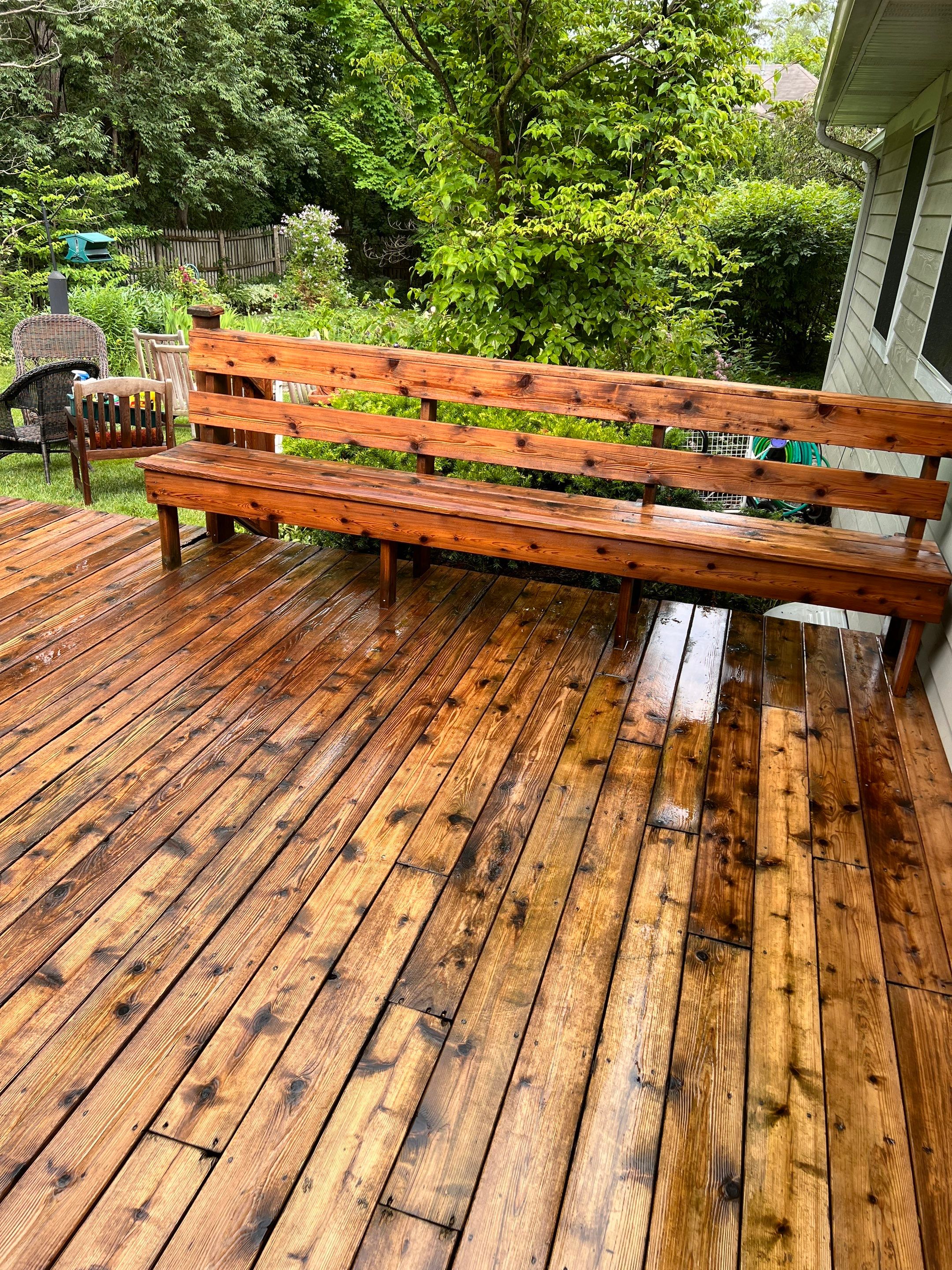 Wood deck cleaning, board replacement and staining by Northern Power Washing LLC.
