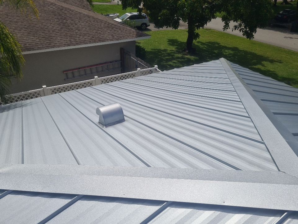 Residential Roofing Installation using 1" Nail strip metal roof by BLUES BROTHERS CONSTRUCTION CORP