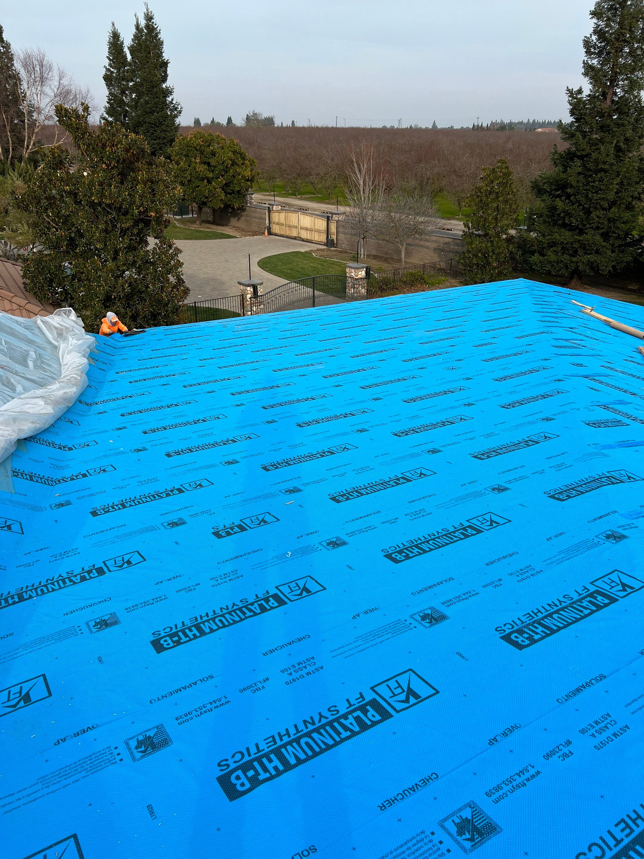 Tile, Metal, and TPO roofing project (new construction) by Straight Edge Roofing Inc