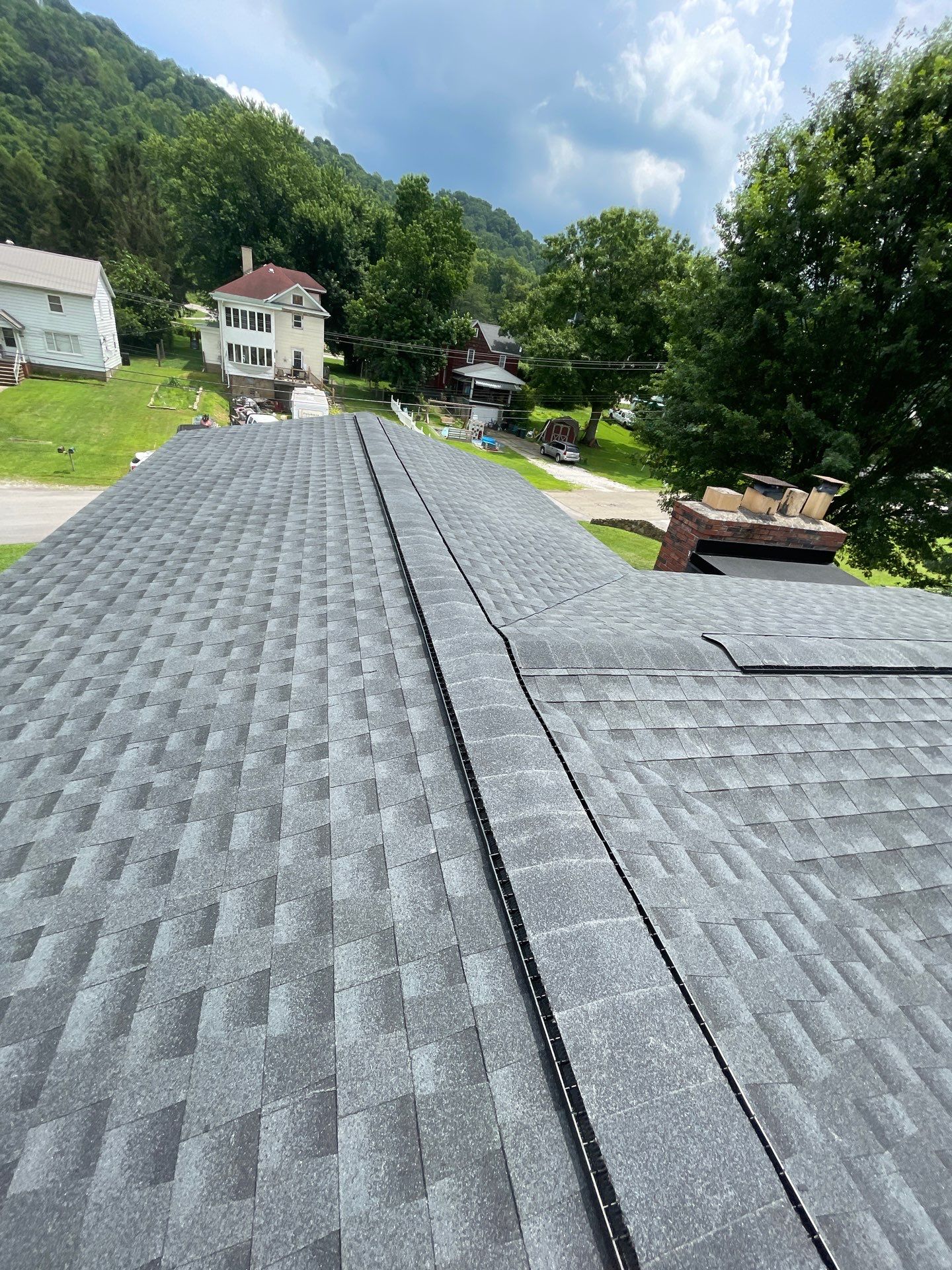 Residential Roofing Installation using GAF Timberline HDZ Charcoal by Rainstoppers Roofing