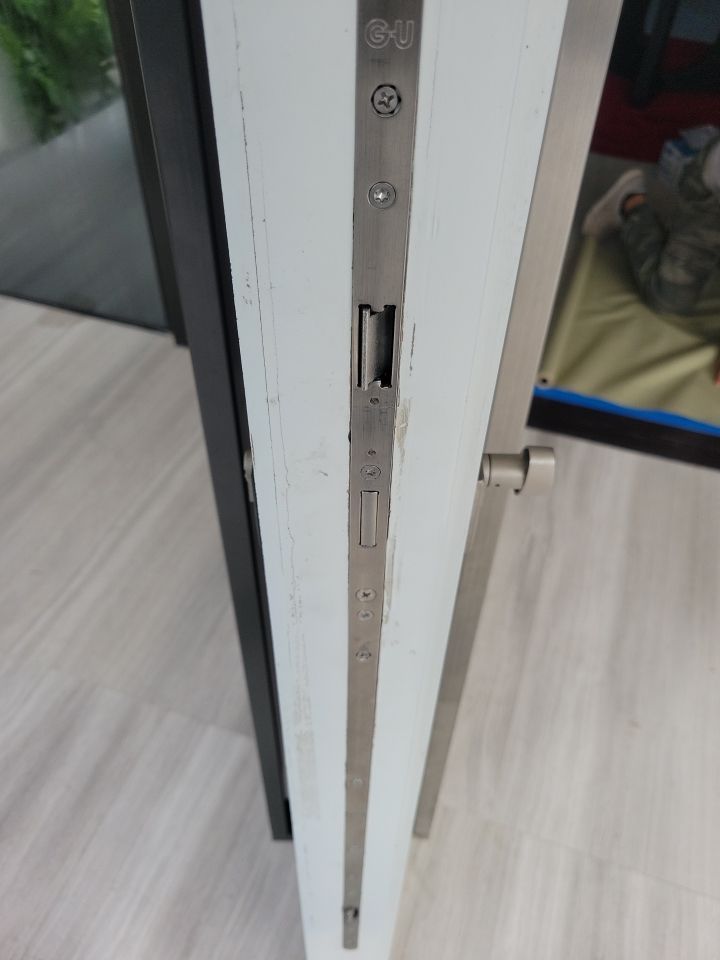 Custom Material Pivot Door installation by Impact Precious Wood Inc.