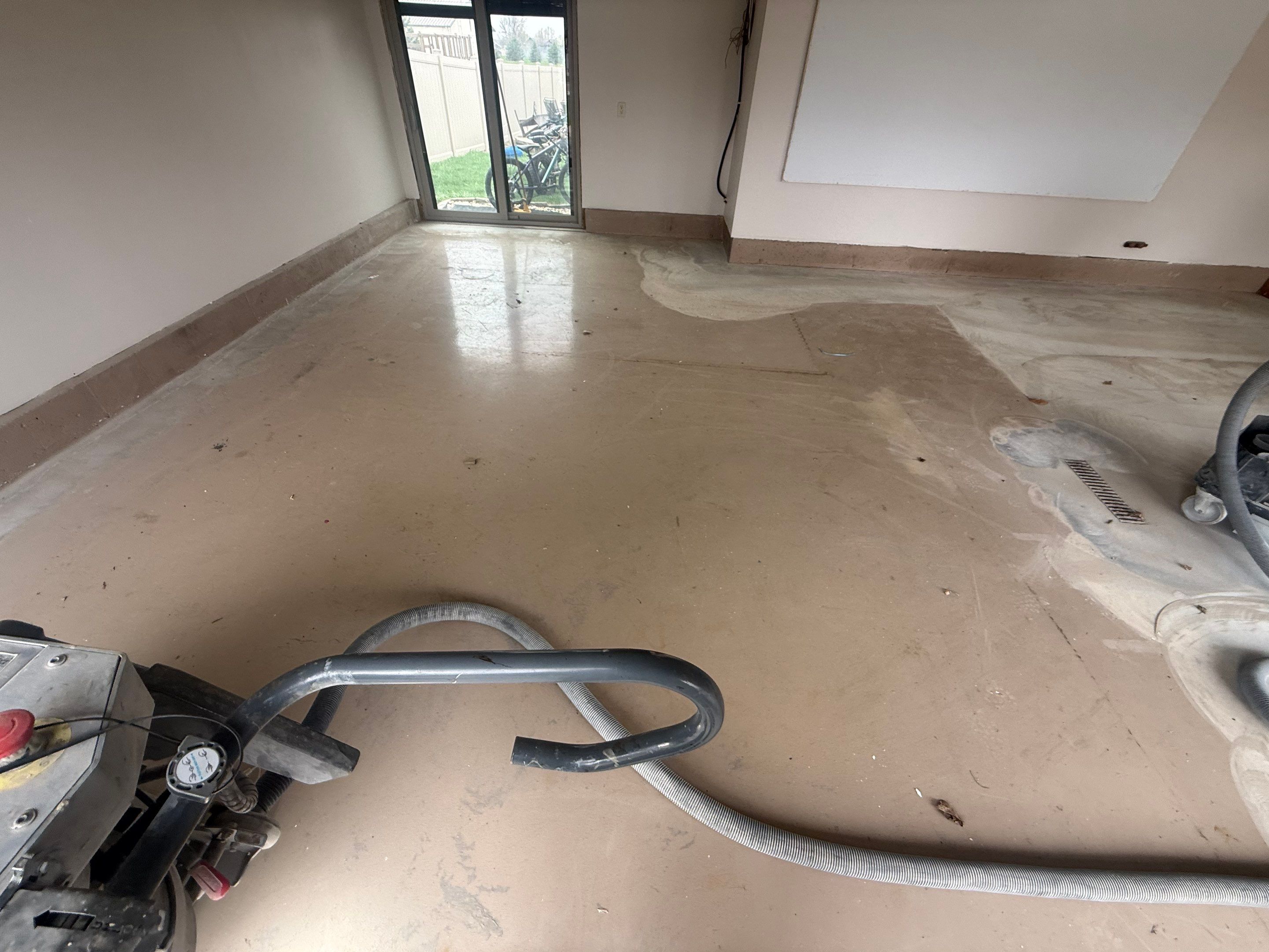 Residential Garage Floor Coating with Grey Speckled Epoxy Finish by Select Painting, Coatings & Garage Cabinets