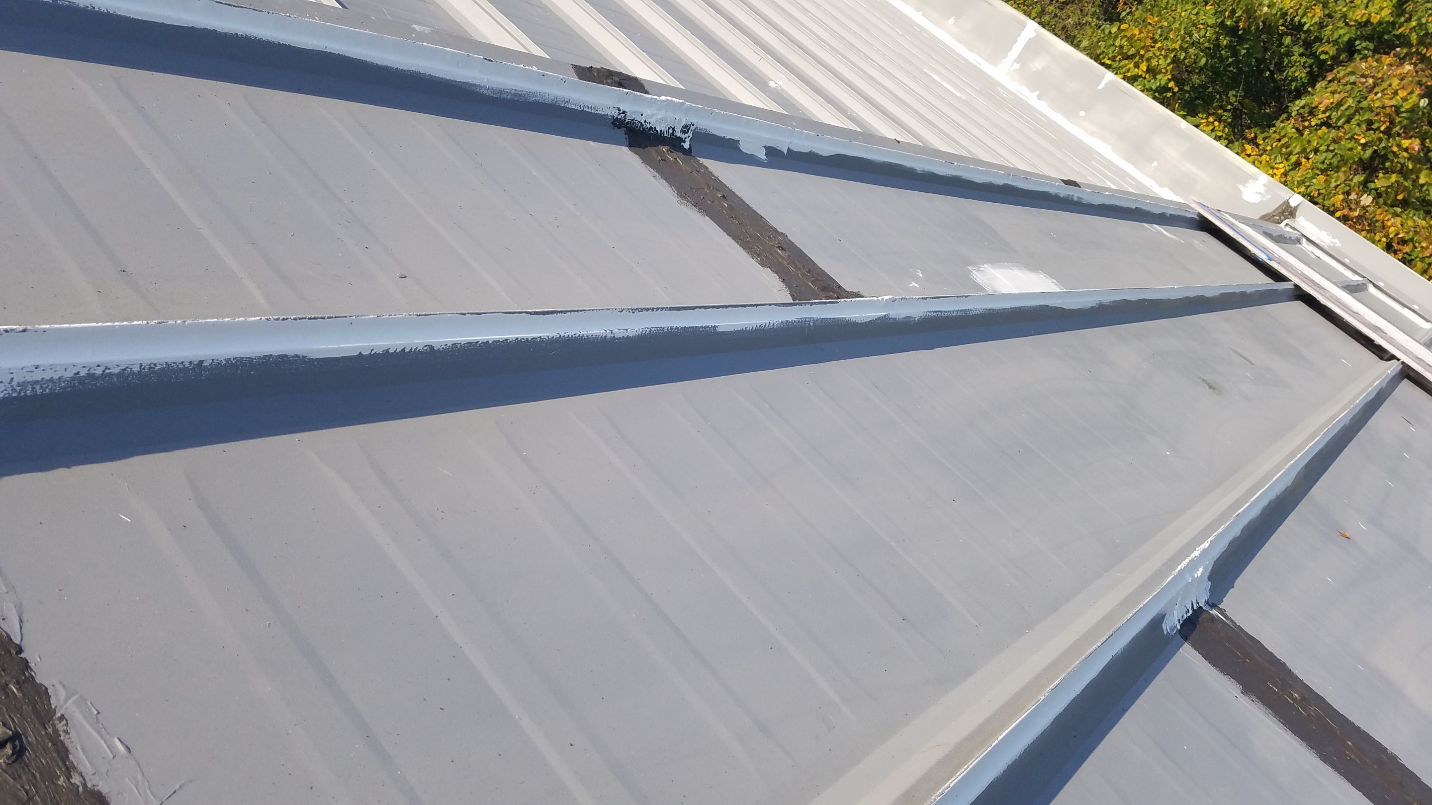 Commercial Metal Roof Coating by Gold Star Roofing LLC