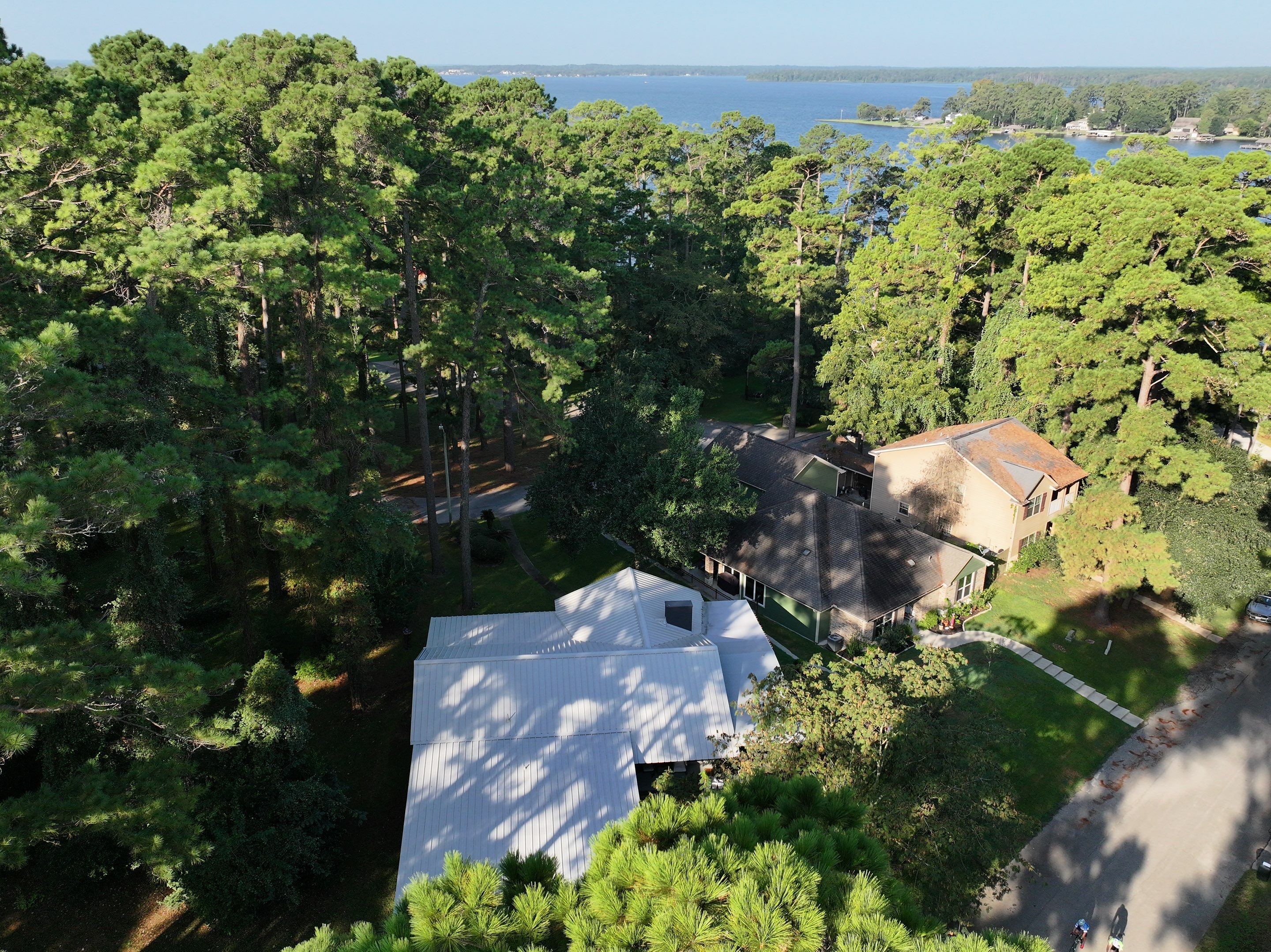 White Standing Seam Metal Roof Replacement in Willis, Texas by Abbott Roofing Company