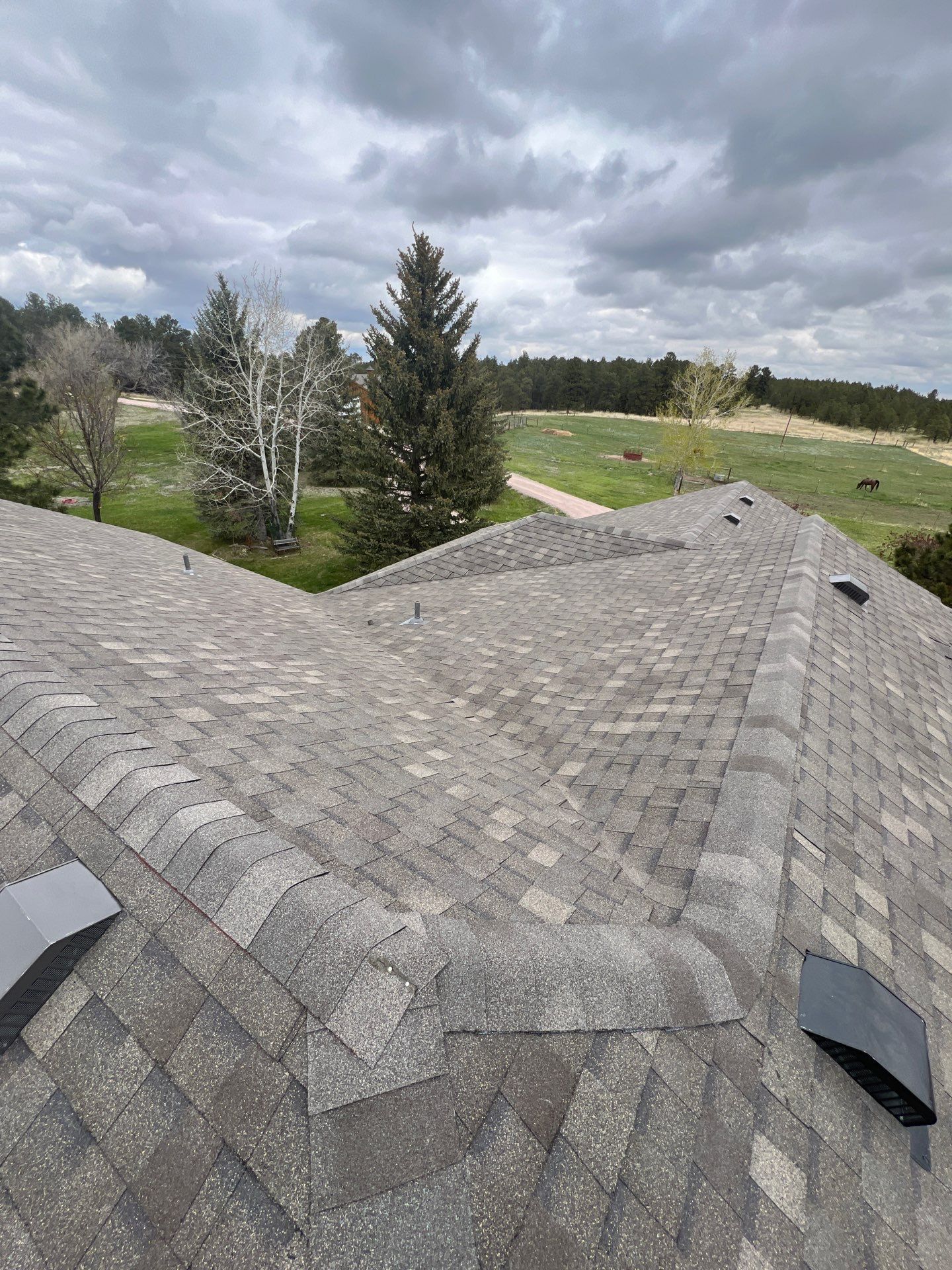 Residential Roofing Installation using Atlas Pinnacle Impact Weathered Wood by Blue Peaks Roofing LLC 