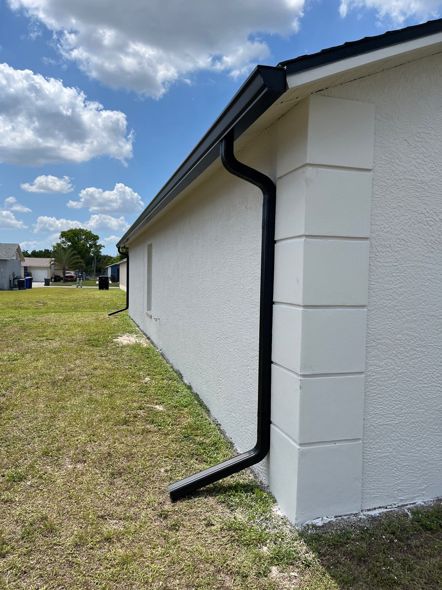 Black Seamless Gutters and Downspouts in Fort Myers FL by Gutter Professors