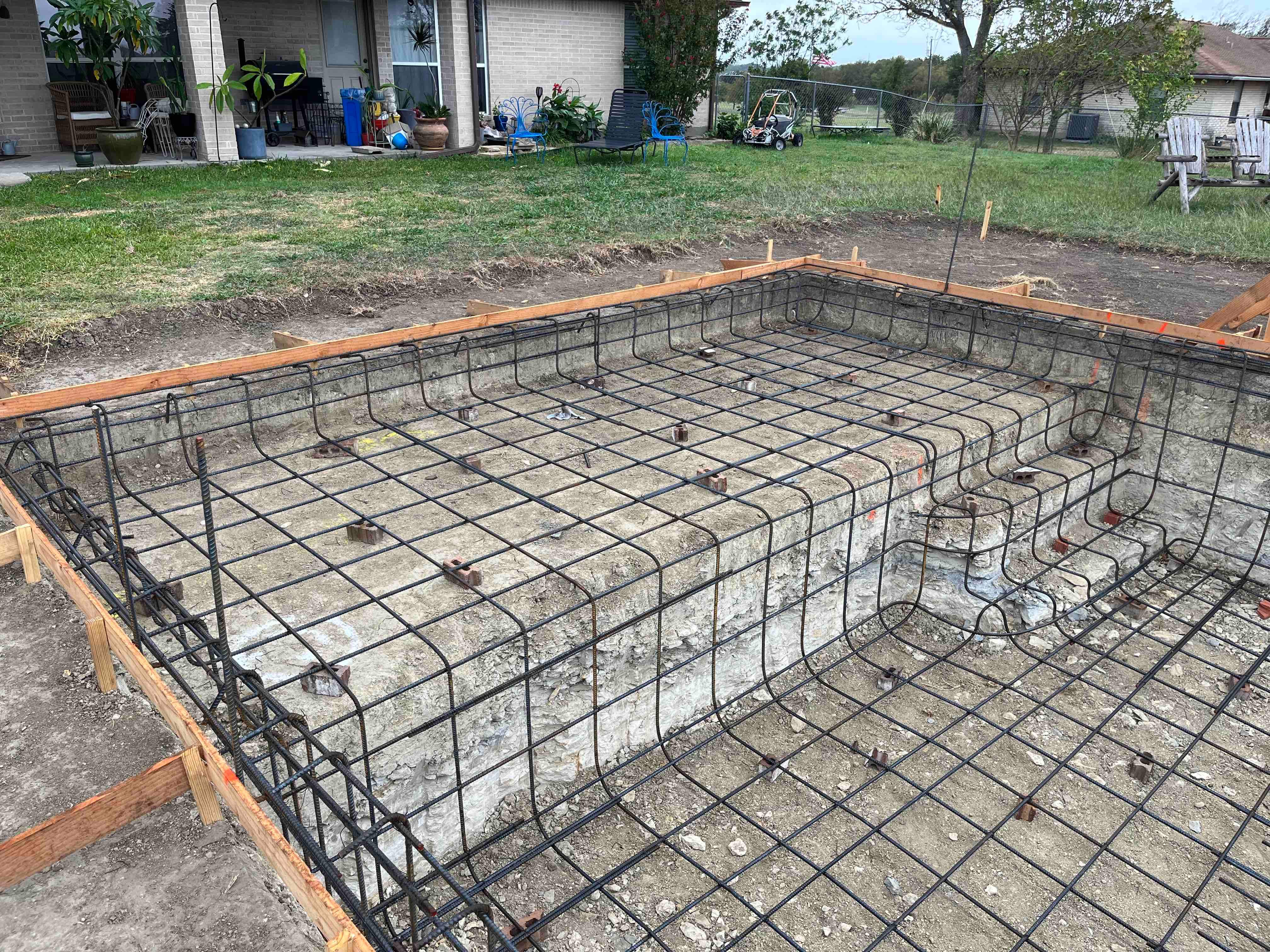 Geometric Pool with Beach Entry, Slide and Raised Spa by Pinnacle Pools and Spas - DFW