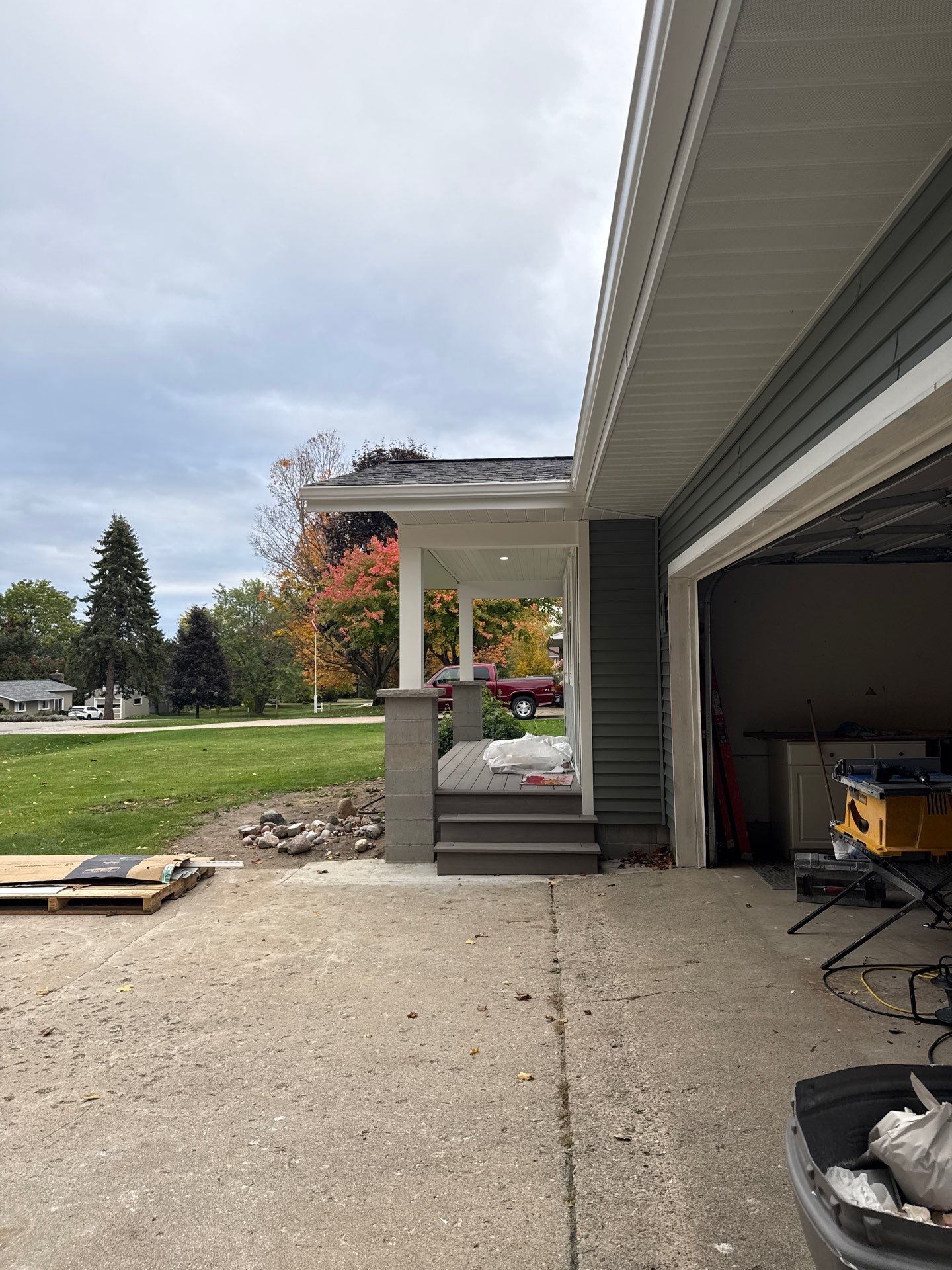 New Aluminum Gutters and White Downspouts for Traverse City Home by Rainbow Seamless Systems