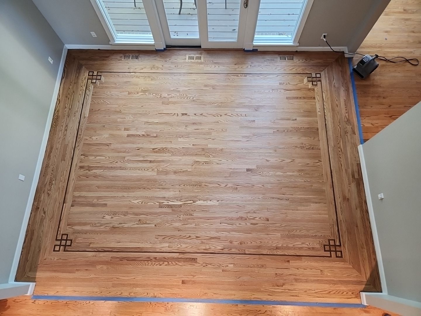 Ann Arbor Elegance: Red Oak and Walnut Living Room Masterpiece by Ann Arbor Hardwoods