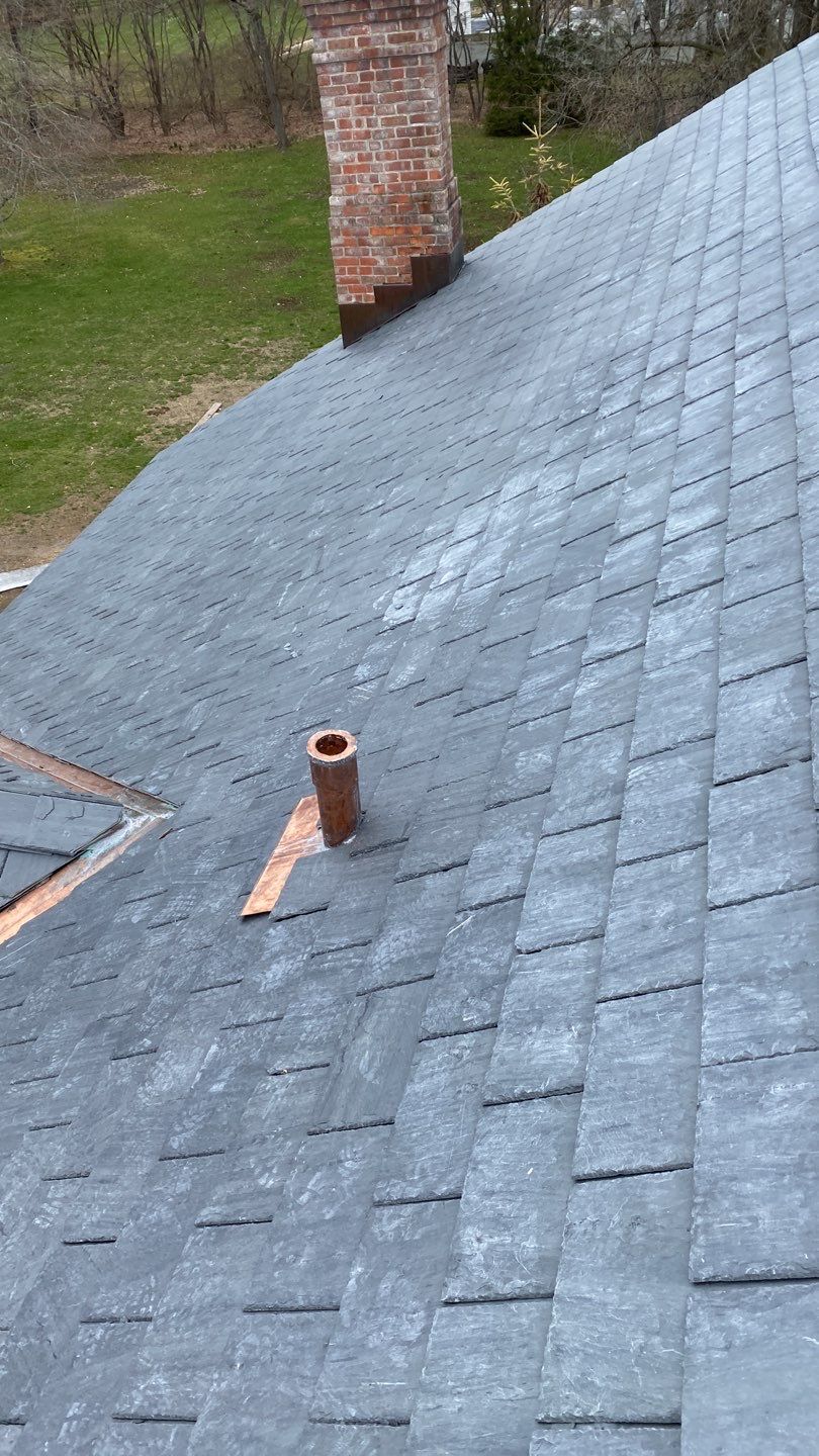 Residential Roofing Installation using Vermont Slate by A Plus Exterior