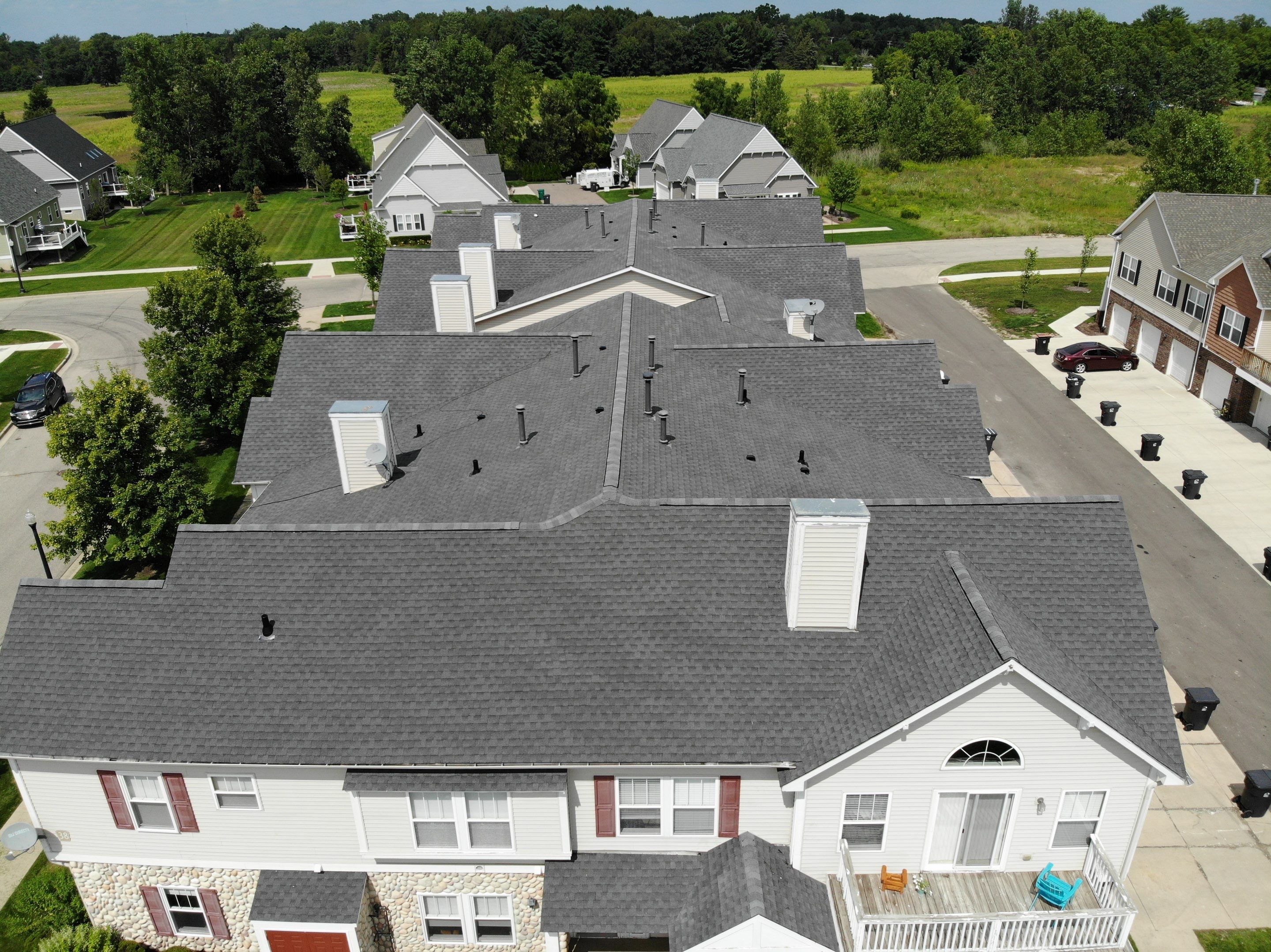 Multi Family Large Scale Roof Replacement by Bloomfield Construction & Restoration