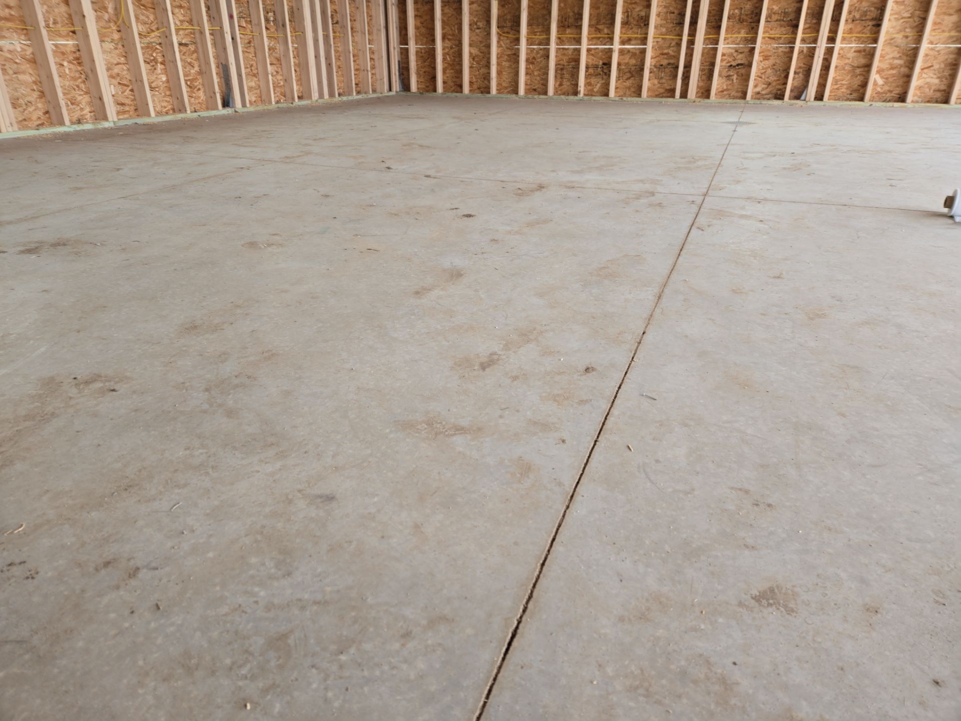 Speckled Epoxy Floor Coating for Large Shop in Rock Valley by Select Painting, Coatings & Garage Cabinets