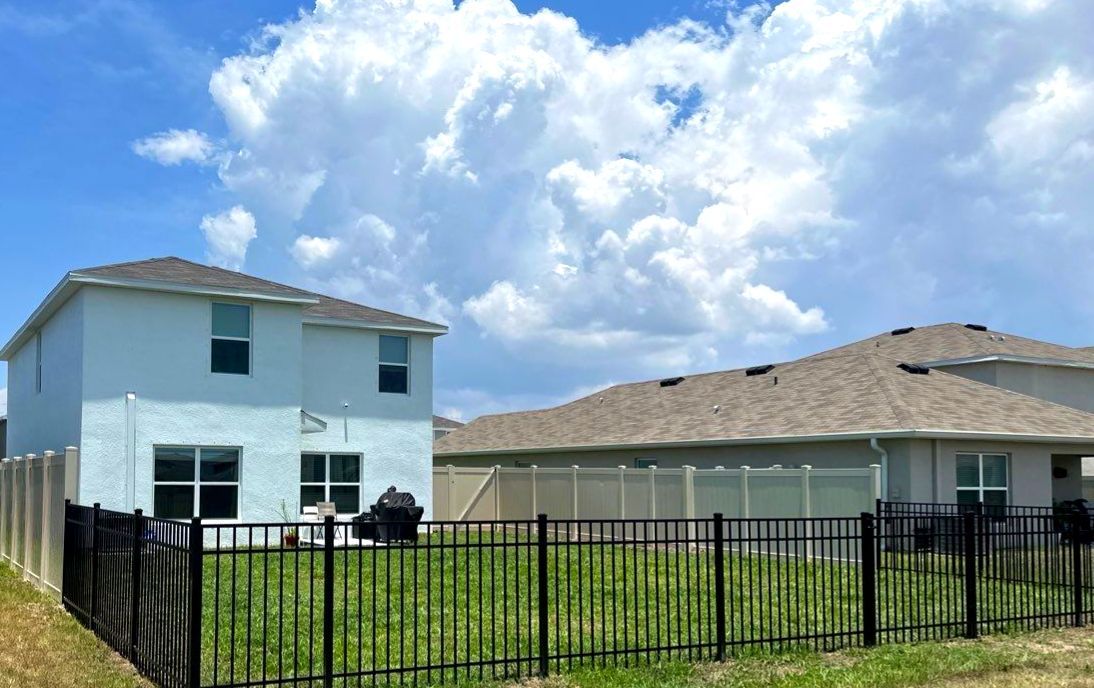 Aluminum Fence Installation using Black 3 Rail Aluminum Fence and Tan Vinyl Privacy Fence by Asap fence and gates, LLC