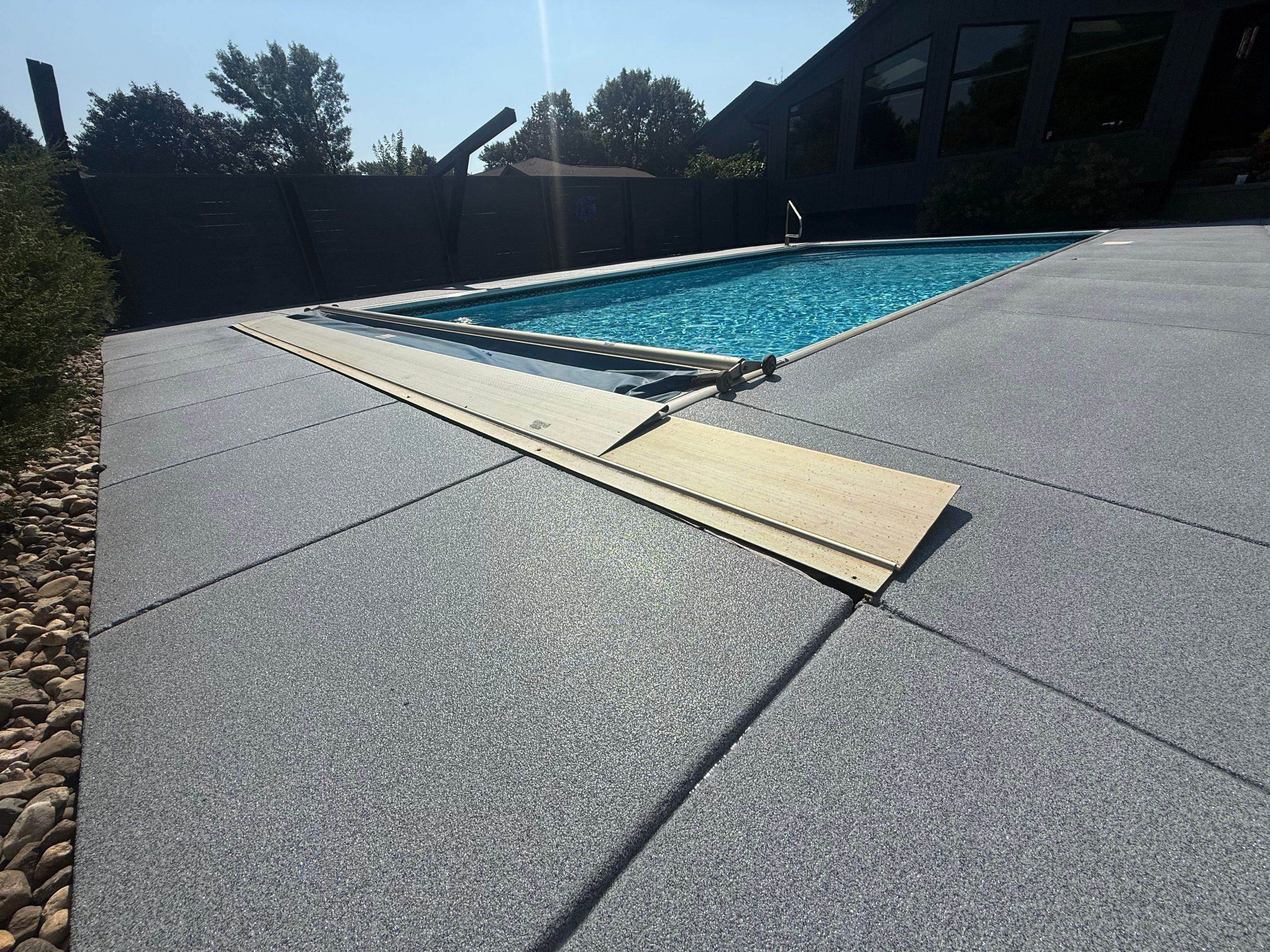 Garage Floor and Textured Pool Deck Coating in Sioux Falls by Select Painting, Coatings & Garage Cabinets