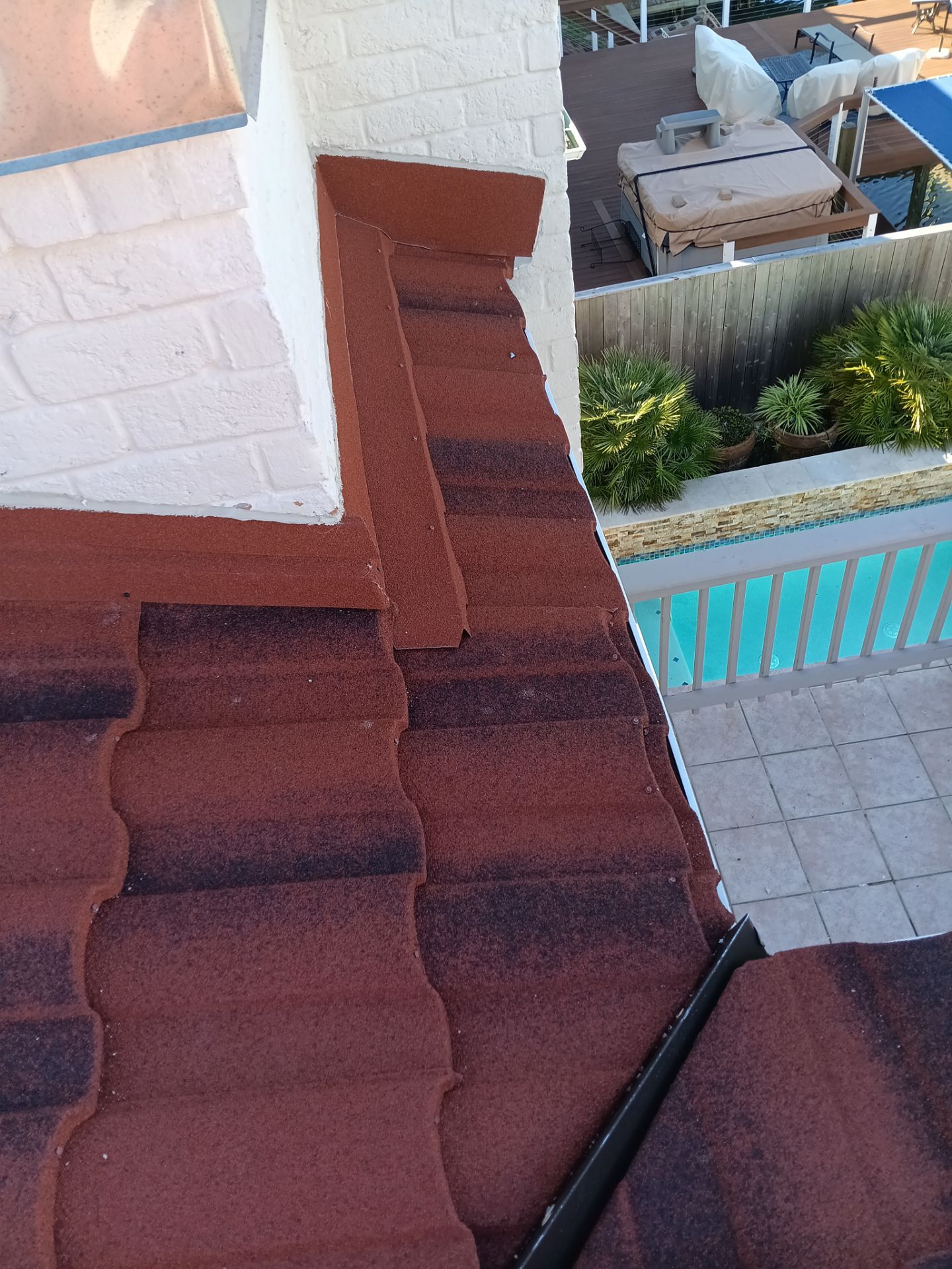 Off with the Tile and on with the TILCOR stone coated metal.  by Bayfront Roofing and Construction