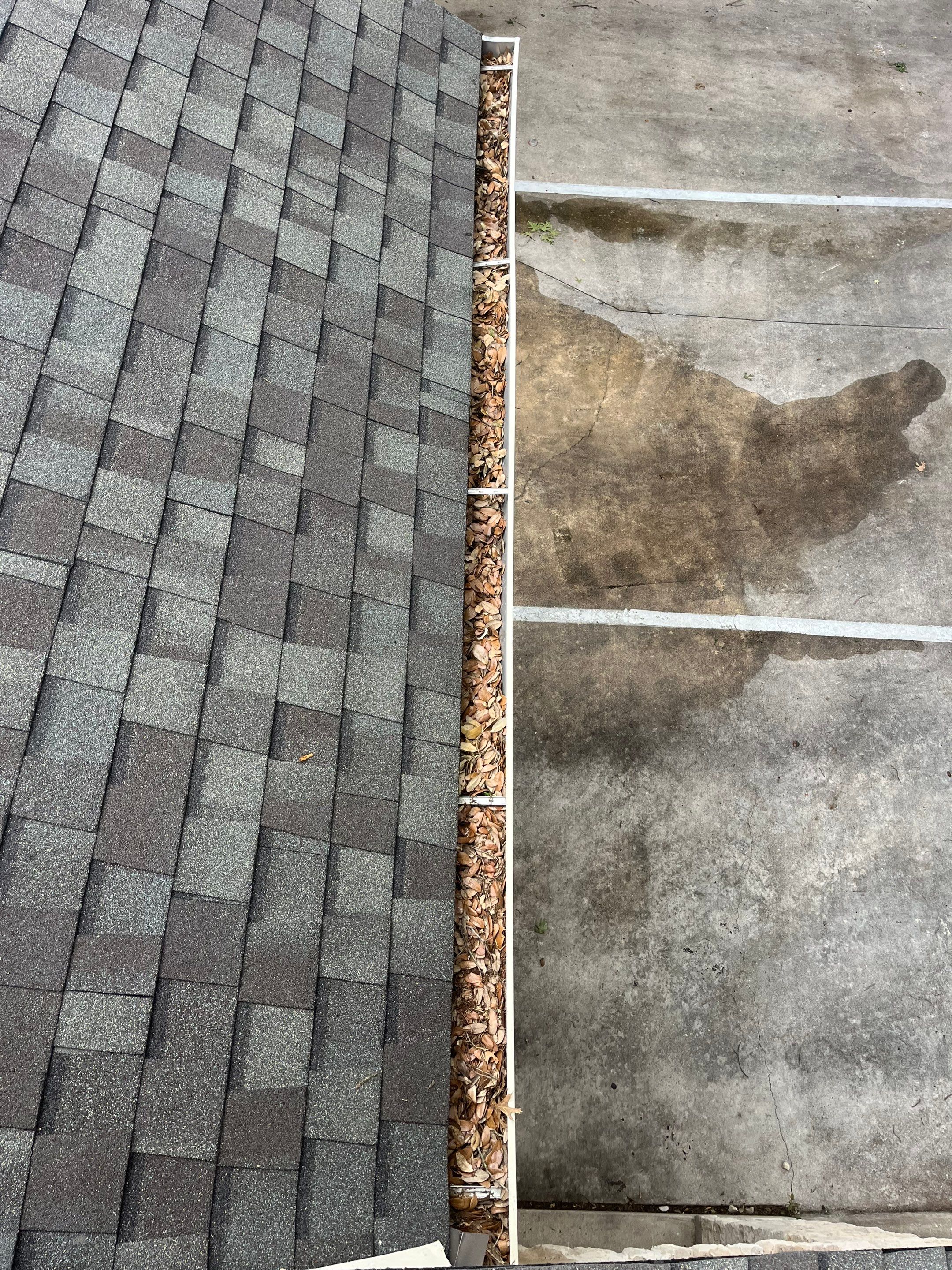 Commercial gutter cleaning Round Rock & Georgetown, TX	 before photo with filled gutters